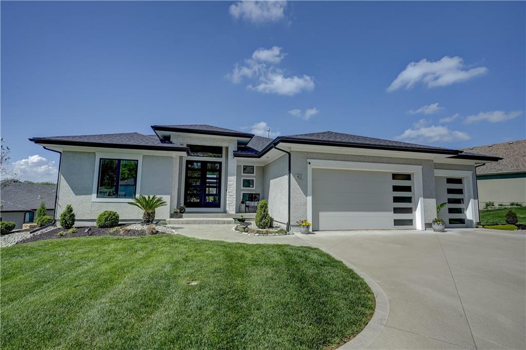 Stunning reverse 1.5 story lakefront home tucked away on a private cul-de-sac lot with awesome water views and direct lake access. This newer 4-bedroom, 3.5-bath home offers an open and spacious layout designed for both everyday living and entertaining. The kitchen is beautiful with custom cabinets, quartz countertops, & Stainless appliances. Enjoy private lake views from the main living areas and step out onto the covered deck to relax or take in the scenery. The finished walkout basement provides additional living space, bedrooms, and easy access to the backyard oasis. Beautifully maintained with extensive landscaping, irrigation system, and a sidewalk leading to your private dock for effortless days on the water. House is located in a cove so perfect for fishing, swimming, and floating with no boat traffic. A rare opportunity to own a move-in ready waterfront home with luxury features, privacy, and incredible outdoor living.