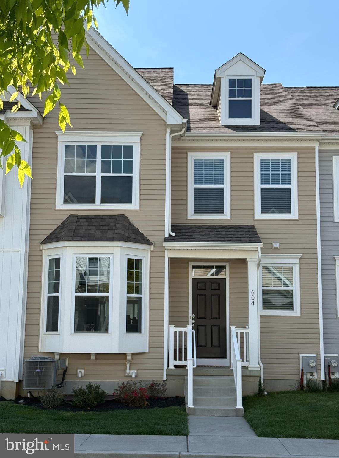 East Village Downingtown is one of the most highly desirable communities in Chester County and is within the Downingtown Area School District. The Allen Traditional is a two story, east facing townhome, with three bedrooms, 2 1/2 bathrooms, & oversized two car garage . The spaciousness of every room is rarely found in a townhome. Meticulously maintained and presented in pristine, move-in condition, the home features brand-new carpeting throughout the second floor and a fresh, professionally painted interior. The main level offers an expansive layout with wide-plank hardwood flooring, while the second floor houses three generously sized bedrooms. The basement is ready to finish with 9' high walls and twin window for egress.  Enjoy resort style amenities including a clubhouse with gathering room & fitness center, community pool, sidewalks, walking trails, & a playground. The monthly HOA fee includes lawn mowing, snow removal of the roads & sidewalks, repair/replacement of the roof, siding, & gutters. East Village Downingtown is an exceptional neighborhood within walking distance to shops & parks, and offers easy access to the 30 Bypass, Route 202, PA Turnpike, and Septa train station. Quick settlement is available.