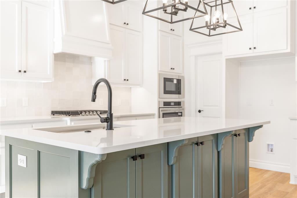 FENCING AND BLINDS INCLUDED! This Hummingbird Bonus Room 1 floor plan includes 2,495 Sqft of total living space, which includes 2,250 Sqft of indoor living and 245 Sqft of outdoor living space. This home offers 4 bedrooms, 3 full bathrooms, a utility room, a bonus room, and a 3-car garage with an in-ground storm shelter installed. The great room embraces a gas fireplace with a stacked stone detail, large windows, wood-look tile, Cat6 wiring, rocker switches throughout, and a flawless cathedral ceiling with a ceiling fan. The up-scale kitchen has stainless-steel appliances including a 5-burner cooktop, decorative tile backsplash, 3 CM countertops, a large center island with a trash can pullout, stellar pendant lighting, well-crafted cabinets to the ceiling with under cabinet lighting and cabinet hardware installed throughout, and a separate walk-in pantry. The prime suite boasts a sloped ceiling detail with a ceiling fan, windows, and our cozy carpet finish. The prime bath supports a dual sink vanity with framed mirrors and 3 CM countertops, a walk-in shower, a free-standing tub and TWO walk-in closets. Secondary bedrooms feature high ceilings with a ceiling fan, windows, sizeable closets, and carpeted flooring. The covered back patio includes an outdoor wood-burning fireplace, a gas line, and a TV hookup. Other amenities include our healthy home technology, an air filtration system, a tankless heater, R44 insulation, and more!