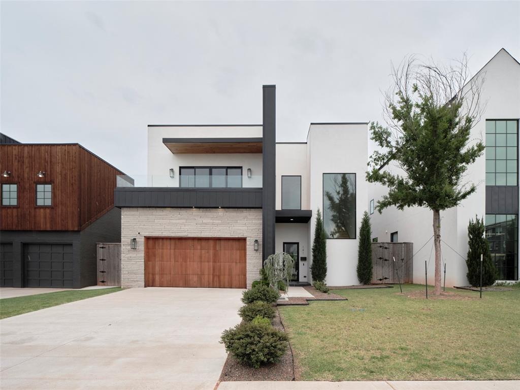 Step into sophisticated living in this stunning new modern build offering 4 bedrooms, 4 full bathrooms, and three levels of thoughtfully designed space just minutes from downtown’s best dining, and entertainment. The open-concept main floor is an entertainer’s dream, featuring soaring ceilings, a show-stopping kitchen with high-end appliances, sleek quartz countertops throughout, and an expansive island perfect for gatherings. The oversized dining area flows seamlessly to a covered porch and a spacious backyard—ideal for future pool plans and outdoor entertaining. A private downstairs bedroom with a full bath is perfect for guests or a home office. Upstairs, retreat to a luxurious primary suite with spa-like bath, accompanied by two additional bedrooms, two more bathrooms, and a generous laundry area for added convenience. The third floor offers a versatile second living area complete with a built-in wet bar and opens to a large balcony showcasing incredible downtown skyline views—the perfect spot for evening cocktails or game-day gatherings. With easy access to major highways and just moments from the heart of the city, this home blends modern luxury, comfort, and unbeatable location. Your dream home awaits—schedule a private showing today!