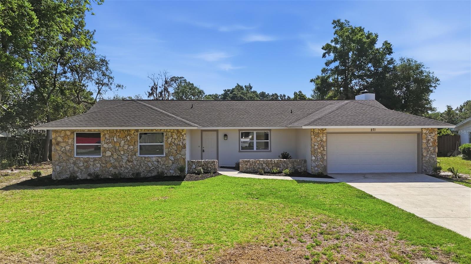 Fully Remodeled | New Roof (2023) + HVAC (2026) + New Windows (2026) | 1,764 Living Sq Ft | Move-In Ready! Welcome to 271 SE 54th Ave in Ocala — a fully renovated 3-bedroom, 2-bathroom home offering 1,764 living square feet (2,268 total under roof) with major system updates already completed. This home has been thoughtfully remodeled inside and out, providing a clean, modern feel from the moment you arrive. The interior features updated flooring, fresh paint, and a functional layout designed for both everyday living and entertaining. The kitchen offers updated cabinetry, ample counter space, and a layout that flows seamlessly into the main living areas. The open floor plan features a spacious primary suite and two additional bedrooms that can easily serve as guest rooms, office space, or flex use. Recent upgrades include a new roof in 2023, a brand new HVAC system and hot water heater installed in 2026, offering added peace of mind for the next owner. The property also features a generously sized yard with space for outdoor living, entertaining, or future customization. Conveniently located in SE Ocala with easy access to shopping, dining, and major roadways. Move-in ready and easy to show.