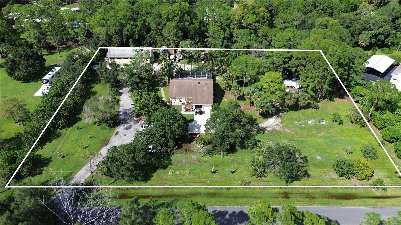 Don’t miss this 4-bed, 2-bath home in the desirable community of Jupiter Farms. Set on 2.5 acres, the property provides plenty of room to spread out and enjoy the outdoors while still being close to shopping, dining, and conveniences. The home features an split floor plan with comfortable living spaces, and the acreage includes a variety of fruit trees along with a barn for extra storage, workspace, or hobbies. Whether you’re looking for room for recreational vehicles, gardening, or simply enjoying extra space, this property offers flexibility to fit your lifestyle.  Lots of space for toys in the detached 60x30 garage / workshop set on 8'' thick concrete pad w/ 110v / 220v, 12' entry doors on both sides. Half of property is agriculture homesteaded as Lychee farm.