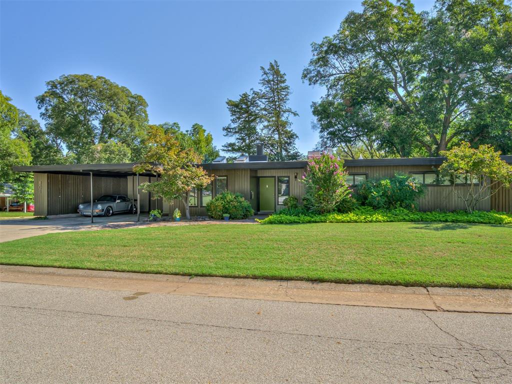 Rare opportunity to own a truly distinctive home in the heart of Norman’s Campus area. Full of architectural character, this property offers a style and personality that is increasingly hard to find. Soaring vaulted ceilings with exposed wood beams, walls of windows and an abundance of natural light create a dramatic, open living space, while the painted brick fireplace, original built-ins and striking black tile floors add to the home’s mid-century character. The updated kitchen complements the original architecture with rich green cabinetry, white countertops, stainless appliances, updated hardware and lighting, while preserving the character that makes the home special. Multiple living and dining spaces provide flexibility for everyday living, entertaining, working from home or creating a space entirely your own. Outside, the generously sized lot offers another exciting opportunity. With ample room for a potential Accessory Dwelling Unit (ADU), the property may offer possibilities for a guest house, private office, studio or additional living space. Located in one of Norman’s most sought-after areas near the University of Oklahoma, this is far more than a typical Campus property. It is a home with remarkable architecture, a fantastic location and the space and potential to evolve with its next owner.