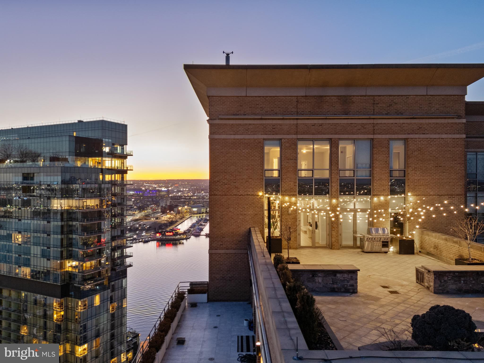 Elevated high above Harbor East, this impeccable two-story penthouse at The Vue offers an unparalleled blend of luxury, space, and breathtaking panoramic views of the water and city skyline. Spanning over  5,000 square feet, this four-bedroom, three-and-a-half-bath residence is designed for sophisticated living. Floor-to-ceiling windows flood the space with natural light, while the gourmet kitchen complete with gas cooking provides the perfect setting for culinary creativity. The home office or potential fifth bedroom features a wet bar and a rough-in for an additional bath. The expansive primary suite is a true retreat, featuring a spa-inspired bath with double vanities, a walk-in shower, and a soaking tub, along with dual dressing rooms. Step outside onto the spectacular 47’ x 28’ private terrace, ideal for alfresco dining, urban gardening, or simply soaking in the stunning views. This penthouse also includes three deeded garage parking spaces and two storage bins. The Vue is ideally situated in Baltimore’s most sought-after neighborhood, just steps from world-class dining, boutique shopping, Whole Foods, Starbucks, the Inner Harbor, waterfront, and vibrant nightlife. The condo fee covers AC, heat, water, security, and concierge services. Residents also enjoy direct access to the MAC gym and Harbor East Cinemas  adding to the convenience and luxury of this remarkable property.