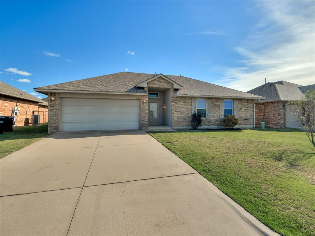 Welcome to 604 Heather Lane in Moore! This charming 3-bedroom, 2-bathroom home offers approximately 1,352 square feet of comfortable living space with an open and functional floor plan. Step inside to find a spacious living area featuring vaulted ceilings, wood-look flooring, and a cozy fireplace with a beautiful wood mantel. The kitchen offers ample cabinetry, generous counter space, a breakfast bar, and an adjoining dining area, making everyday living and entertaining a breeze. The primary suite features a tray ceiling, spacious walk-in closet, and private bathroom. Additional highlights include a dedicated indoor laundry room, neutral finishes throughout, and French doors leading to the large backyard. The backyard features a koi pond with a beautiful waterfall and a shed. Conveniently located in Moore with easy access to shopping, dining, and major highways, this home offers comfort, convenience, and plenty of possibilities. Schedule your private showing today!
