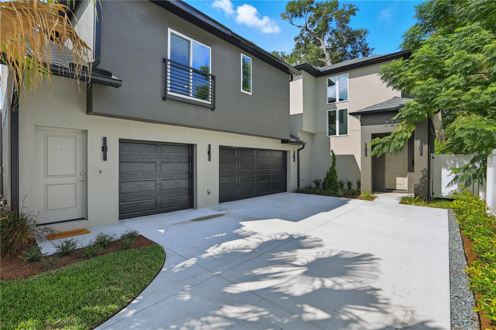 Opportunities like this don’t come along often. Located in Orlando’s College Park community, where brand new construction typically exceeds $1+ million, this home offers the luxury of new build living at a rare and attainable price point.  The main residence features 3 bedrooms, 2.5 baths, and a 2-car garage, thoughtfully designed with open living spaces, abundant natural light, and sleek finishes including stainless steel appliances. Step outside to a fenced backyard, perfect for pets, entertaining, or evenings under the oak-lined skies of this historic neighborhood.  But what truly sets this home apart is its attached private suite. With its own entrance, living area, full bath, and garage, plus pre-plumbing and wiring for a kitchenette, this flexible space opens the door to endless possibilities. Whether you envision it as an in-law suite, guest apartment, home office, or rental income unit, it transforms this property into a 4 bedroom, 3.5 bathroom, 3-car garage home with 2,300+ sqft of living space.  Beyond the home, you’re buying into a lifestyle. Stroll the brick-lined streets of College Park, grab a latte at a neighborhood café, or bike to the Packing District and YMCA. In minutes, you can be in Downtown Orlando, Winter Park, Advent Health Village, or on I-4 for an easy commute. With no HOA restrictions, you have the freedom to enjoy this home your way.
This is more than a house, it’s a chance to live in one of Central Florida’s most desirable neighborhoods, blending modern construction, timeless charm, and unmatched versatility.
