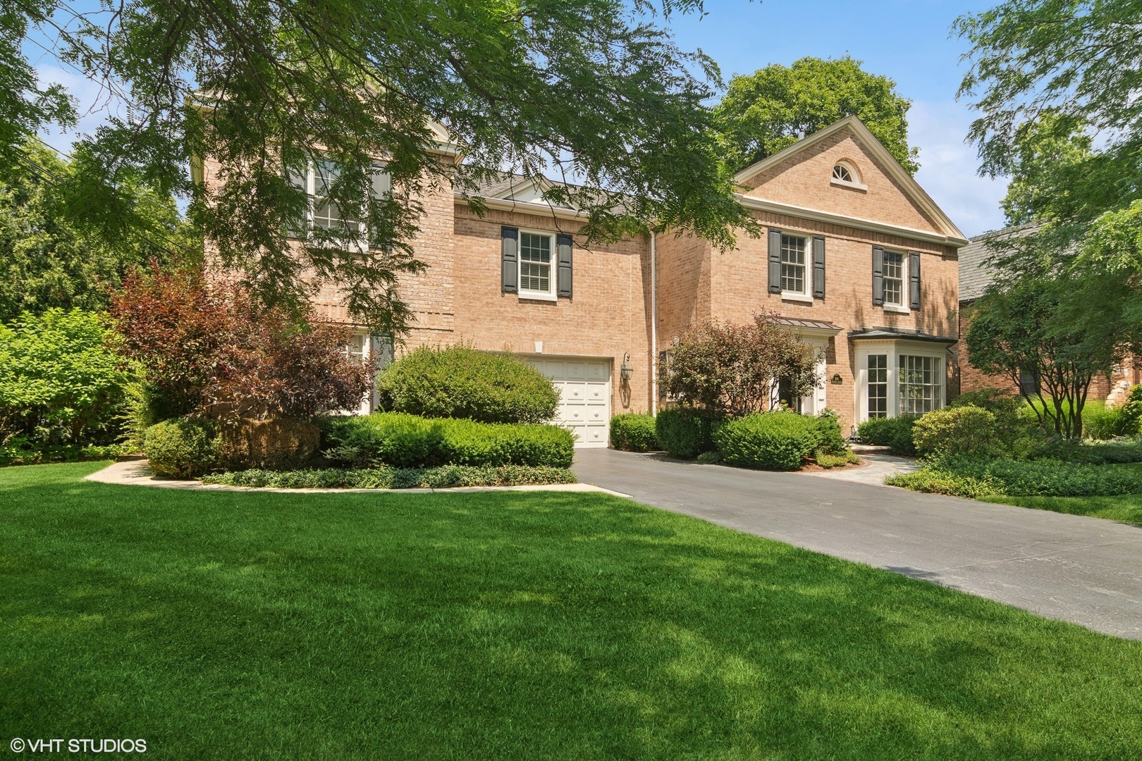 Welcome to 500 East Mayfair Road, a truly one-of-a-kind Tacket-built masterpiece nestled in the heart of Arlington Heights. Situated on a double lot, this architectural stunner seamlessly blends timeless design with luxurious modern living. Boasting four spacious bedrooms and four full bathrooms all on the upper level and additional two 1/2 baths on main level, this home offers an ideal layout for both comfort and functionality. The primary suite is a true retreat, featuring separate his and hers baths and his and hers walk-in closets, designed for relaxation and convenience.  From the moment you enter, you'll notice the distinctive craftsmanship that defines this residence. Dramatic lines, rich textures, and thoughtfully curated materials make every space feel both elegant and welcoming. Large windows flood the home with natural light, highlighting the exceptional design and generous proportions throughout. The dramatic feature in the Great-Room is the 27 foot-tall clerestory delivering a true wow factor! Outside, the expansive double lot provides endless possibilities-from hosting unforgettable gatherings to creating your own backyard oasis. Whether you're enjoying quiet evenings on the patio or entertaining on a grand scale, this property delivers on space, style, and setting.  Located in a highly desirable Scarsdale neighborhood just minutes from vibrant downtown Arlington Heights, award-winning schools, parks, dining, and Metra access, this home is truly a rare find. Welcome Home!