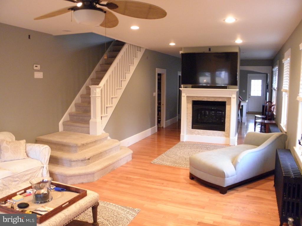 If GQ magazine featured homes, this modernized beauty could be a featured story. Meticulously remodeled to levels rarely seen, this 3-bedroom, 1 1/2-bath colonial showcases amazing craftsmanship, as well as some high-tech upgrades, and is simply amazing. The open floor plan expands the moment you walk in the front door, with 9 ft ceilings, the warmth of the living room is evident as you see the dual-sided fireplace with the TV mounted above. Continue through to the dining room on the opposite side of the fireplace, then into the large kitchen with a custom countertop, bar seating, lots of cabinets, and a large island. The first floor also includes a modern half bath and a pantry. The 2nd floor features a large master bedroom with a walk-in closet and a stackable washer and dryer. The closet also leads to the beautiful main bath, which has a main entry as well as the master entrance. The large 2nd bedroom is tastefully decorated and has a large closet. The 3rd floor is a large bedroom, or could be for someone who needs to spread out, and includes a vaulted ceiling, and is just as lovely as the rest of this gorgeous home. Welcome, friends, on the front porch of your new home. Top off with a full, finishable basement, a porch off the kitchen, and a nice yard, and you have home sweet home. You will admire this home and want to make it yours. We look forward to your visit!