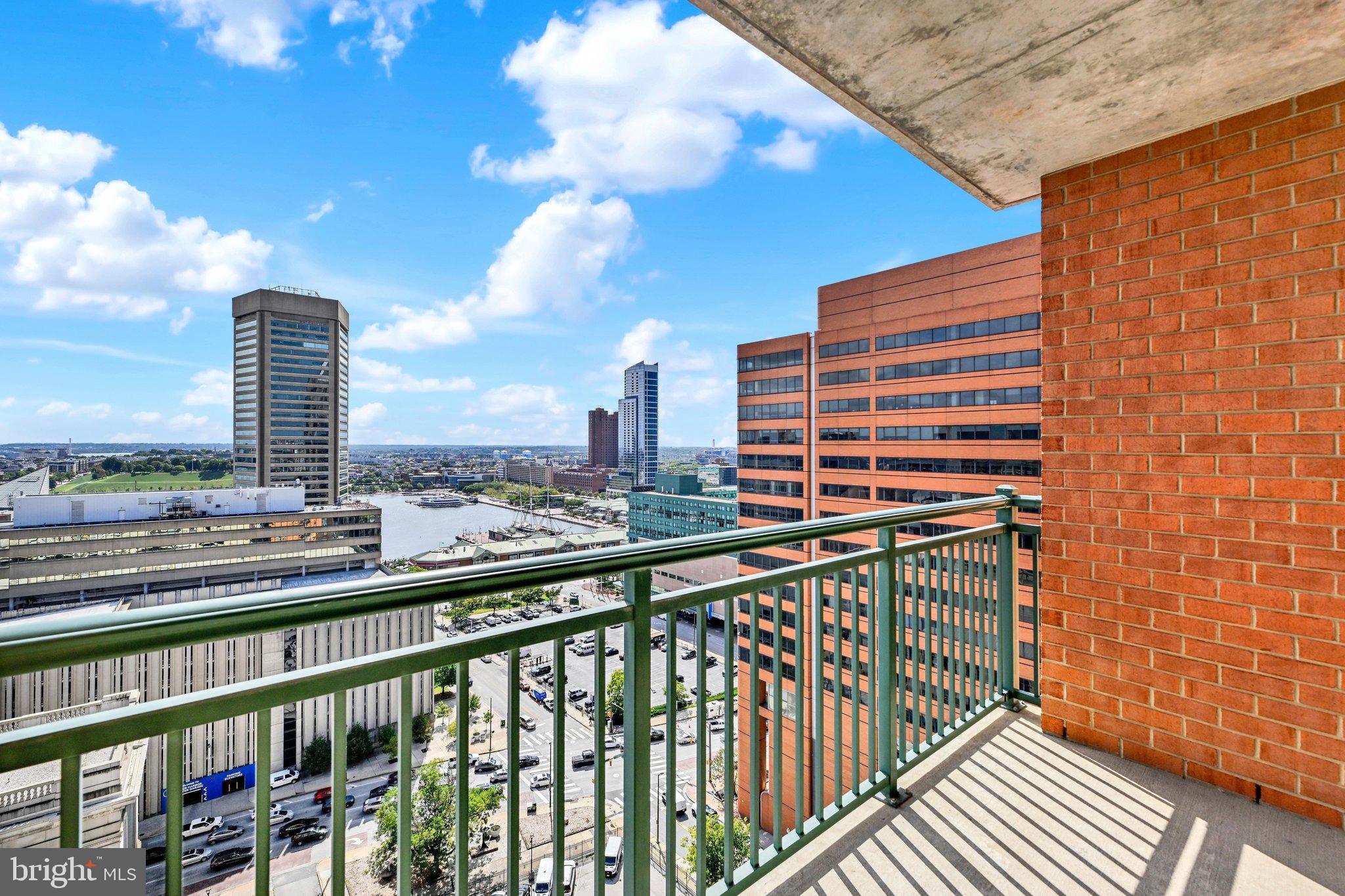 Inner Harbor views. Your own balcony. Garage parking. Make your next move to 414 Water Street. This bright 18th-floor, 2-bedroom, 2-bath condo pairs waterfront views with everyday convenience. Oversized windows, hardwood floors, and an open layout create an inviting living space, while stainless steel appliances and a granite island make cooking and entertaining easy. Step onto your private balcony for morning coffee or an evening overlooking the harbor and city skyline. Enjoy a heated pool, fitness center, business center, and resident gathering spaces—all minutes from waterfront dining, Little Italy, and Camden Yards. Pet-friendly, with a premium garage parking space included. Ready to call the Inner Harbor home? Schedule your showing today.