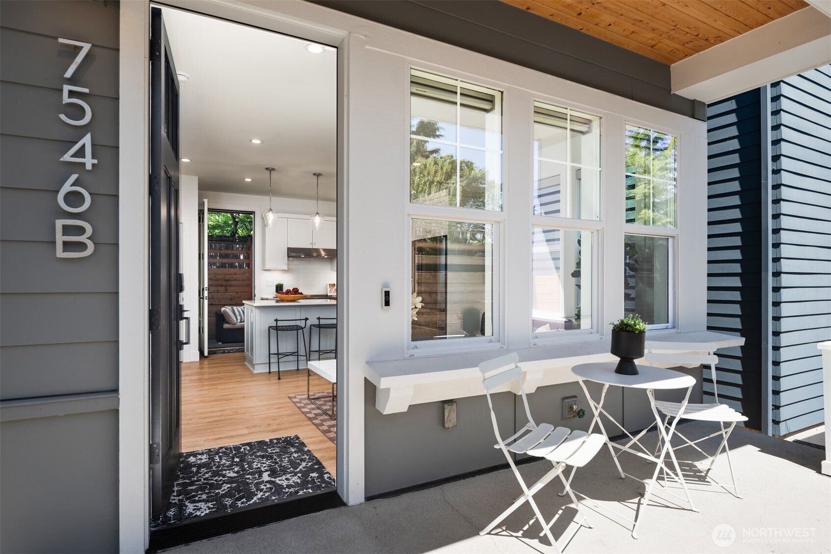 Modern construction, unbeatable price, pure livability. This 2BR/2.5BA in Loyal Heights was built in 2023 by respected local builder Thomas James Homes (builder warranty still in effect). This modern cottage is the perfect alternative to a boring condo or skinny vertical townhome: two stories instead of three, quaint front porch, a private fenced patio with an additional yard and shed, and ductless mini-splits for heat and A/C in every room. The full-size kitchen features luxury appliances from Electrolux and cabinets from Belmont. Each bedroom has its own en-suite, and there's a main-floor powder room to boot. End unit, south-facing, with extra natural light and added privacy. The self-managed HOA is just $125/mo and covers water, sewer, and garbage; pets allowed, no rental cap. Walk to Larsen's Bakery, the Ballard Farmer's Market, or head to Golden Gardens for morning dog walks, and Sunset Hill Park for the evening view. Loyal Heights Playfield, Carkeek Park, and the Ballard Locks are minutes away, and downtown is reachable in under 20 minutes. Pre-inspected, sewer-scoped, vacant, and easy to show.
