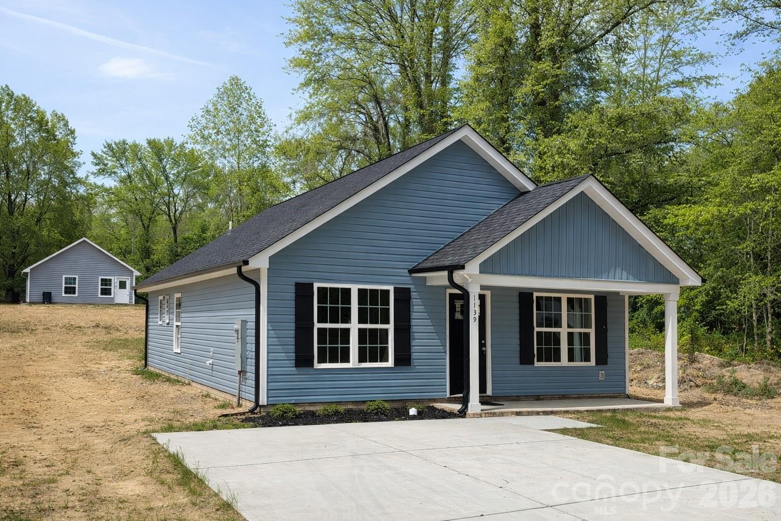 Welcome to this beautiful new construction home in Salisbury, NC, offering 3 bedrooms and 2 full bathrooms with a thoughtfully designed open floor plan. This move-in-ready home features durable LVP flooring, recessed lighting, and a bright, neutral color palette that enhances natural light throughout the living space.The modern kitchen is equipped with granite countertops, soft gray cabinetry, stainless steel appliances, and ample counter space, making it ideal for everyday living and entertaining. The open layout flows seamlessly into the dining and living areas, creating a warm and inviting atmosphere.The primary bedroom suite includes plush carpeting and a private ensuite bath with a dual-sink granite vanity and contemporary finishes. Two additional bedrooms provide flexibility for guests, a home office, or additional living space.total of 4 houses available on contiguous lots.Enjoy outdoor living with a rear patio perfect for relaxing or entertaining. Located just minutes from downtown Salisbury, shopping, dining, parks, and major roadways, this home offers the perfect combination of modern construction, comfort, and convenience.Don’t miss this opportunity to own a brand-new home in Rowan County—schedule your showing today!