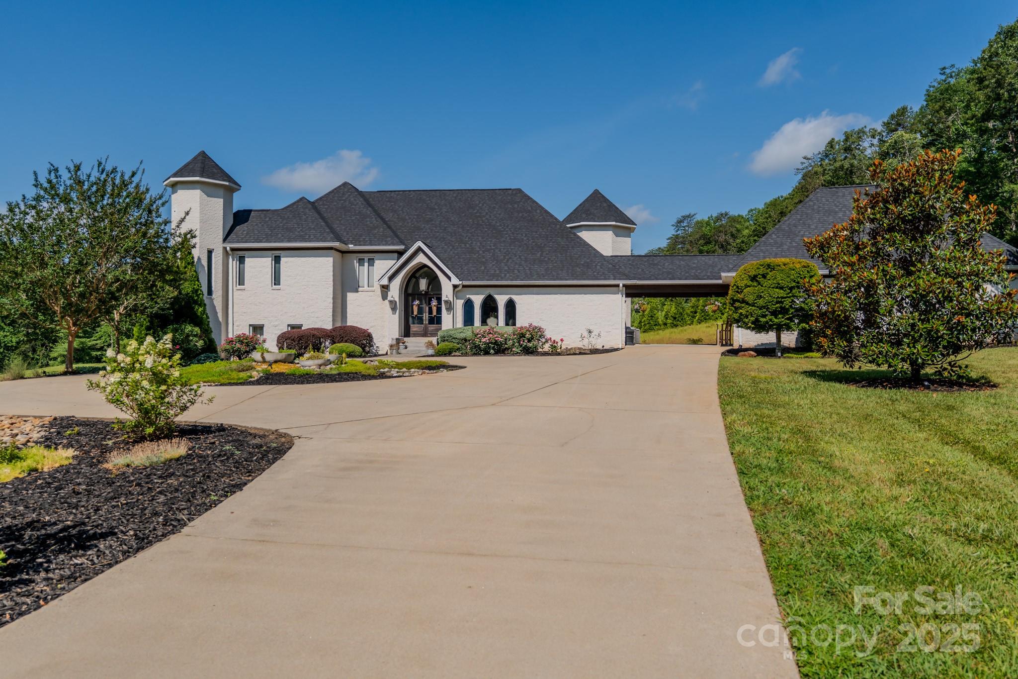 Welcome to a one-of-a-kind sanctuary, where timeless elegance meets modern convenience. Set on 21 secluded acres, this nearly 5,200-square-foot estate offers the ultimate retreat, complete with a serene stocked pond and a luxurious swimming pool. Despite its remarkable privacy, the property is just six minutes from town and only twelve minutes from Tryon International Equestrian Center (TIEC), making it a rare gem for those who seek both peace and proximity.
The home boasts three spacious bedrooms and three and a half baths, designed with meticulous attention to detail. The gourmet kitchen is a chef’s dream, equipped with top-of-the-line Thermador and Sub-Zero appliances, custom cabinetry, and an expansive island perfect for entertaining. Sunlight pours into the open living spaces, where soaring ceilings, tasteful finishes, and thoughtfully placed windows frame breathtaking views of the surrounding landscape.