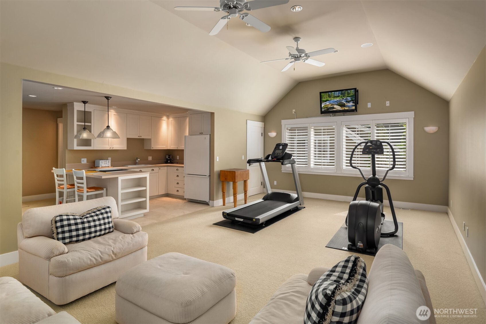 Bonus room with exercise equipment and kitchenette