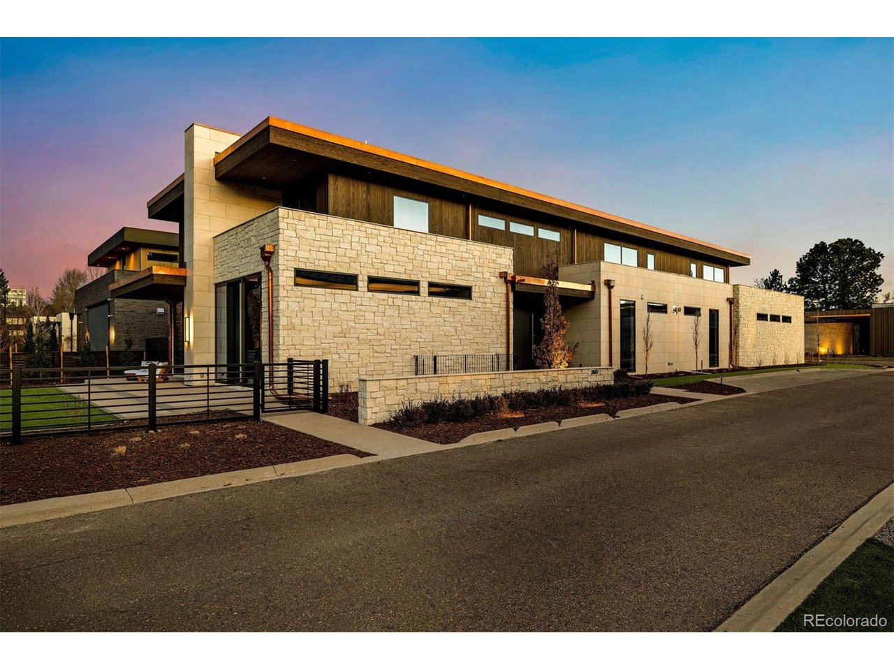 Located moments from Cherry Creek North-walkable to Denver's premiere dining and retail, yet privately set apart-this newly constructed contemporary residence offers architectural integrity and highly curated design.  Clad in natural limestone with accoya wood and copper detailing, the home is part of a thoughtfully-reviewed architectural community and gated enclave that ensures exceptional quality, lasting materials and cohesive design throughout.  Interior finishes were curated by New York designer David Frazier, whose work has been featured in Architectural Digest, Elle Decor and Veranda. His signature use of layered wall coverings, natural stone, deep saturated hues and sculptural lighting creates warm interiors with depth, texture and timeless appeal.  The home includes four bedrooms, each with an ensuite bath.  The primary suite features heated floors, steam shower, bidet and a beautifully curated walk-in closet. Wide-plank oil finished white oak floors, honed marble counters, hydraulic elevator and seamless museum-quality baseboards highlight the exceptional level of finish throughout.  Designed for entertaining, the kitchen centers on a Calacatta marble island and opens to a covered, stone patio through expansive sliding doors for seamless indoor-outdoor living. Wolf /Sub-Zero appliances, built-in Miele coffee maker, multiple dishwashers, wine refrigeration and generous prep space elevate the experience. A bar connects dining and family room. The lower level features an 800-bottle temperature-controlled wine cellar designed for collectors.  Savant whole-home audio, Lutron lighting control, dual Navien tankless systems, whole-house humidification, and three independent AC condensers provide exceptional climate, efficiency and year-round comfort.  This is the only newly constructed home available in Cedar Estates, offering it new owner a refined architectural setting and minimal upkeep. True lock-and-leave living steps from Cherry Creek's energy and amenities.