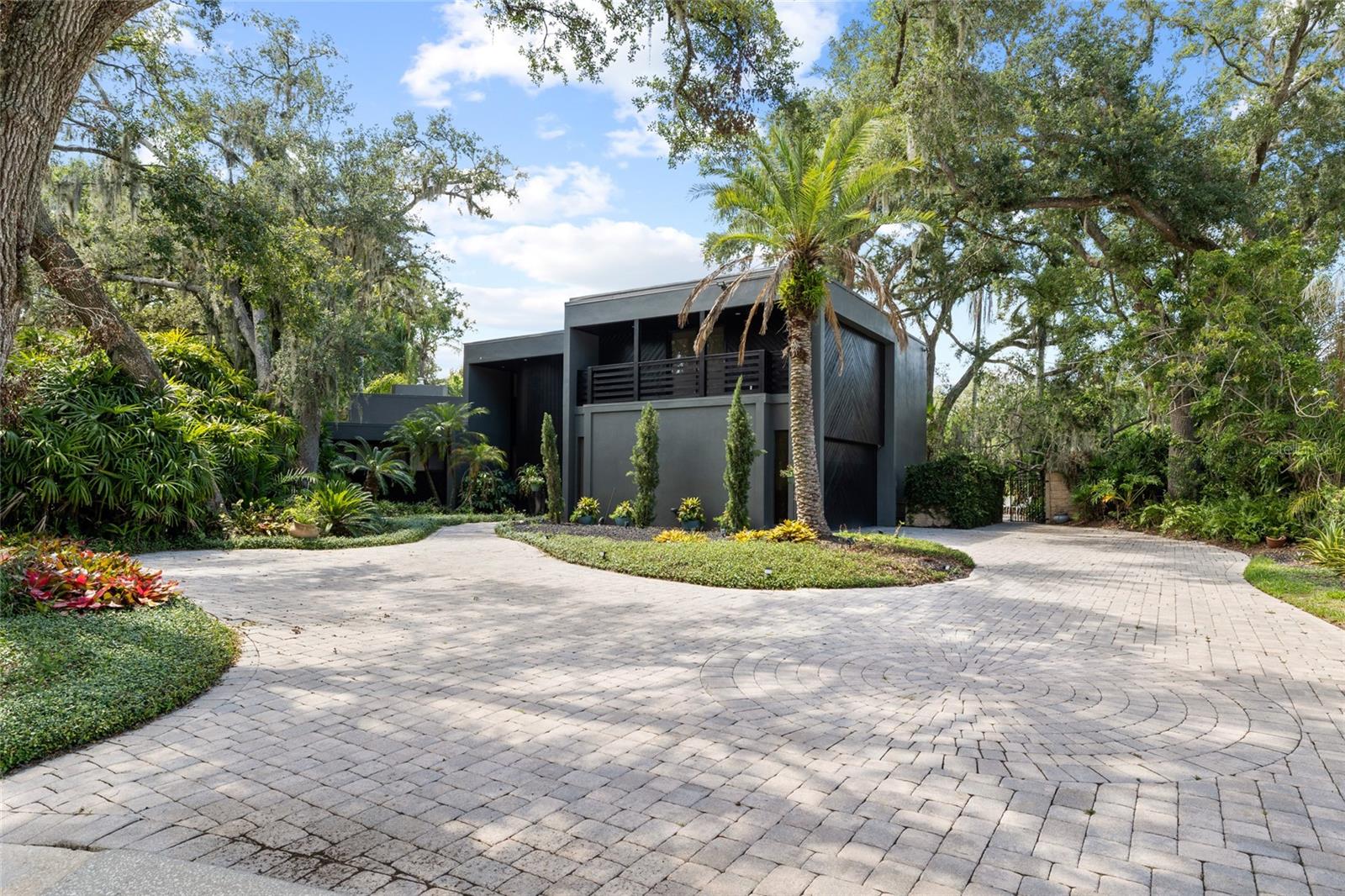 Welcome to 410 Montrose Ave — a truly one-of-a-kind, custom-built home nestled in the heart of the sought-after Temple Terrace Estates neighborhood. Boasting 5 bedrooms, 3.5 bathrooms, and over 4,100 square feet of beautifully designed living space, this residence offers a rare blend of modern luxury and timeless sophistication.

As you arrive, you’ll be captivated by the home’s stunning modern front elevation, stately curb appeal, and a brick-paved driveway that leads to a side-facing, oversized garage. Surrounded by lush landscaping on a generous 0.36-acre lot, the property backs up to the 16th hole of the Temple Terrace Golf Course — offering golf course views with thoughtfully designed privacy.

Step inside to discover a light-filled interior with soaring ceilings and an open floor plan ideal for entertaining. The chef’s kitchen is equipped with an abundance of counter space, sleek cabinetry, and high-end appliances — perfect for hosting family and friends. A spacious living room flows seamlessly to the resort-style backyard, where you’ll find a pebble rock saltwater pool, brick-paved deck, outdoor kitchen, and multiple seating areas for ultimate relaxation.

Designed with both function and flair, the home offers space for everyone — whether you're hosting guests, working from home, or enjoying a quiet evening by the pool.

Recent updates include: New plumbing (2025), HVAC system (3 years old), Water heater (4 years old), & Roof resealed (2025).

Located in a mature, non-HOA neighborhood, this home puts you minutes from I-275, I-75, Downtown Tampa, Busch Gardens, and the University of South Florida.

Don’t miss your opportunity to own this incredible estate in one of Tampa Bay’s most charming and central communities. Schedule your private tour today and experience true Florida living!