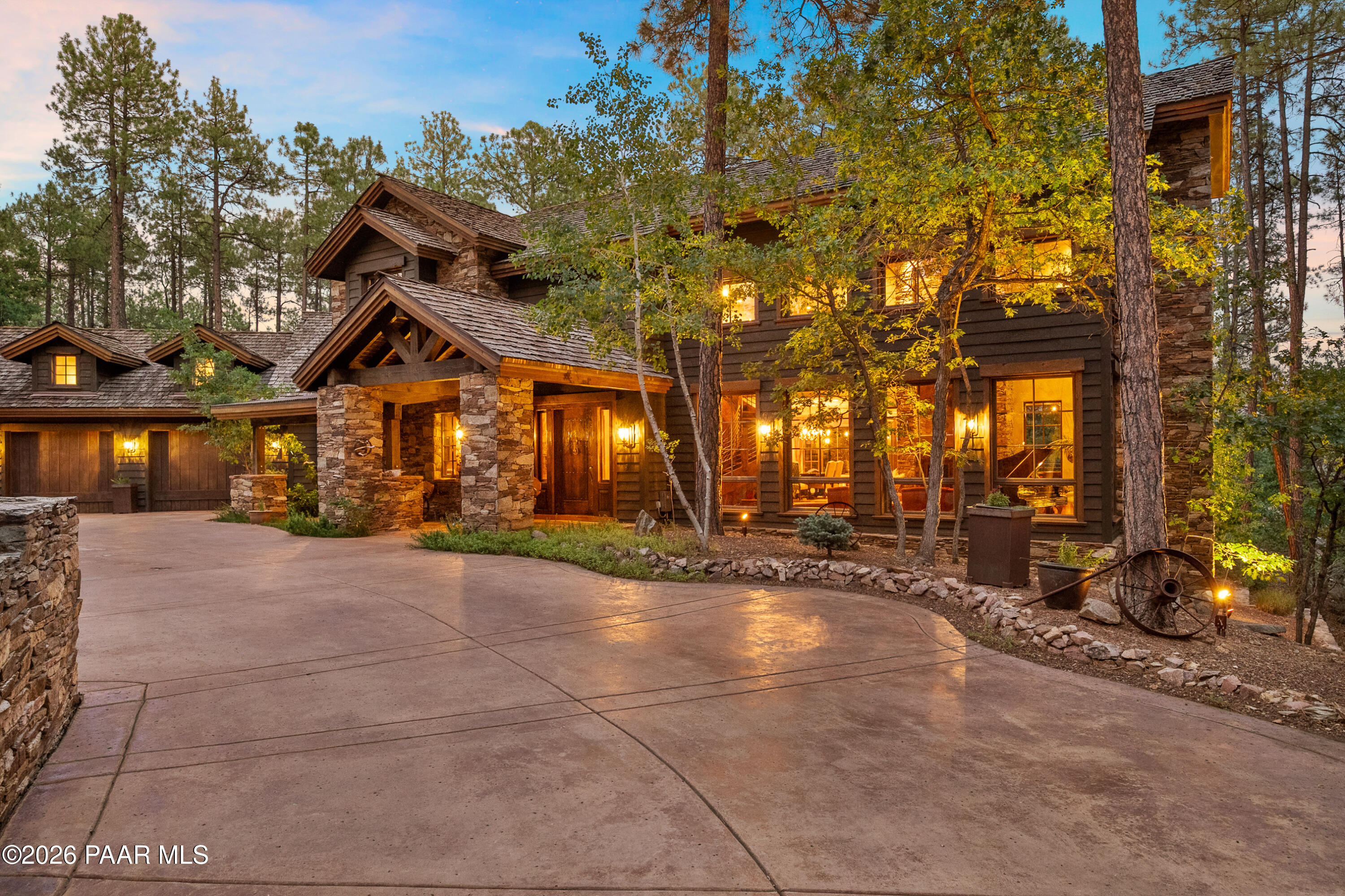 Originally homesteaded over 100 years ago, High Valley Ranch, with crystal mountain streams, lush alpine meadow, and stands of oak and ponderosa pine, is now an exclusive enclave of exquisitely custom 2-acre estate homes minutes from historical downtown Prescott.  The design philosophy of using the finest organic elements and materials to seamlessly blend architecture with nature has been accomplished in this exceptional home. From windows reaching the sky to whiskey oak barrel floors, and true stone finishes, the understated grandeur is apparent in every detail.  Massive wood beams, the finest masonry craftsmanship, artisan created metal work and wall finishes are highlighted throughout the main floor living interior in quiet mountain luxury.  Whether a forever home, mountain getaway, or legacy property for generations to come, this High Valley Ranch estate offers the epitome of luxury mountain living and the convenience of city lifestyle.
