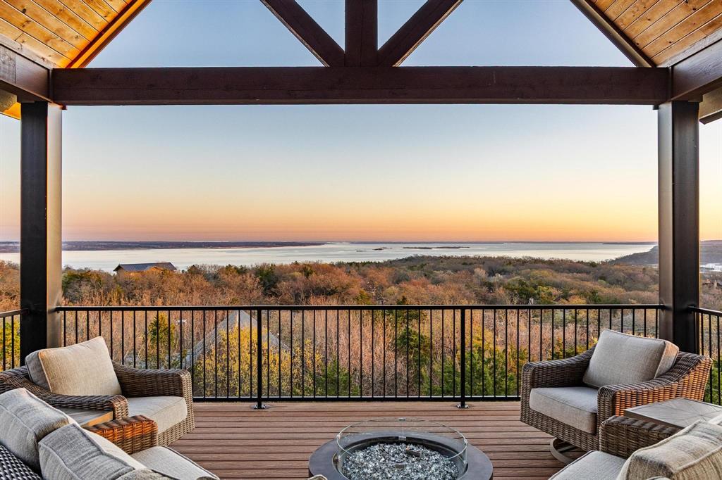 Welcome to one of the finest homes ever offered on Lake Texoma.  Located at 220 Oak Hills Drive in the highly desirable, wooded, and gated community of Oak Hills Estates, this extraordinary, turnkey, lakeview property offers luxury, privacy, and breathtaking panoramic views.Spanning 4,491 square feet, the home features 5 bedrooms and 4.5 bathrooms, thoughtfully designed with high-end custom materials and exceptional craftsmanship throughout.  Expansive Kolbe windows and doors frame spectacular 180-degree views of the lake, filling the home with natural light and seamlessly connecting indoor and outdoor living.The interior showcases hand-scraped hardwood floors, a chef's kitchen equipped with GE Monogram appliances, and refined architectural details that elevate every space.  A Galvalume standing-seam metal roof adds both durability and timeless style.Designed for gathering and relaxation, the property offers multiple outdoor living areas, perfect for entertaining family and guests or enjoying peaceful solitude while overlooking the water.  An oversized garage provides ample space for vehicles, boats, and all of your lake toys.Whether you're searching for a luxury lake retreat, full-time residence, or corporate getaway, this exceptional property offers a rare opportunity to own a truly remarkable home on Lake Texoma.Convenient to Tanglewood Resort and Golf Course, Highport Marina, historic downtown Denison, and Choctaw Casino.