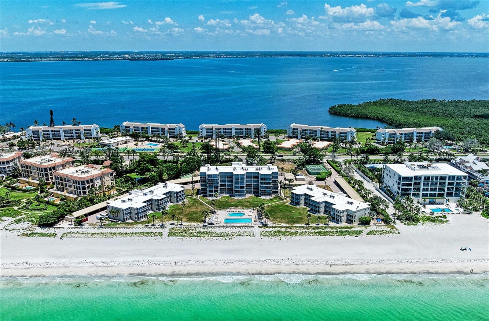 Fabulous Gulf-Front views from this third floor beach-front residence in The Westchester.  Enjoy morning strolls on the beach, sunsets from your lanai, and island living in this spacious two-bedroom, two-bath plan.  With panoramic views of the beach and the Gulf, you'll find nearly 1400 square feet of thoughtfully designed living space featuring a Gulf-front lanai, generous living spaces, large kitchen, and a split-bedroom plan with both bedroom suites boasting en-suite baths, walk-in closets, and privacy for you and your guests.  The Gulf-front primary suite also includes a private screened balcony.  You'll also be pleased to find the safety and security of new electric hurricane shutters, a newer a/c system, assigned covered parking and separate storage unit.  Set in a mid-key beachfront location, The Westchester offers residents private beach access, two Gulf-front pools, tennis courts, pickleball courts, kayak storage, and a clubhouse with fitness center coming soon.  The Westchester is also conveniently located to Longboat's shops, restaurants, grocery, pharmacy, golf, Durante Park, Longboat Key Town Center with it's new outdoor performance stage, and so much more.  You'll also find St Armand's Circle, Lido Key, and downtown Sarasota are all close by.   With its professional on-site management, friendly community, and ideal mid-key beachfront location - make Westchester your new Longboat Key home.