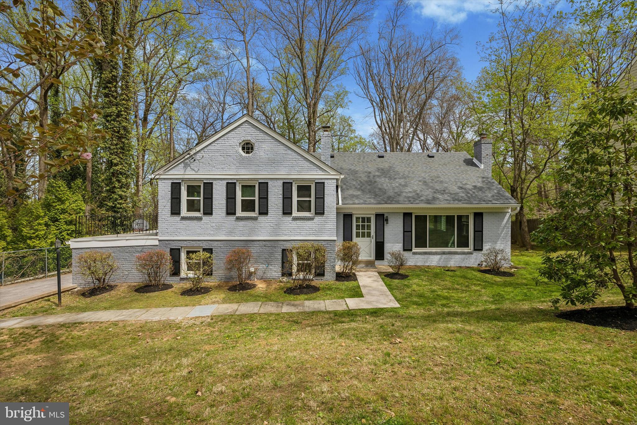 Welcome to 699 West Valley Road, a beautifully updated painted brick split-level home offering 2,299 square feet of refined above-grade living space. Set on a well-manicured 0.69-acre lot, this move-in ready residence combines thoughtful upgrades, timeless style, and the added benefit of low property taxes.  The main level features a spacious living room with custom built-ins and a wood-burning fireplace, creating a warm and inviting focal point. The dining room is accented with elegant chair rail molding and opens to a rear deck—perfect for indoor-outdoor entertaining. The recently renovated kitchen is a standout, showcasing stainless steel appliances, attractive cabinetry, a center island, and a classic subway tile backsplash.  Upstairs, the primary suite offers a private retreat with a generous bedroom, dedicated closet space, a private patio, and an updated en-suite bath featuring tile flooring and a stall shower with frameless glass. Two additional bedrooms and a beautifully updated hall bath complete this level. The top floor provides a versatile oversized fourth bedroom with a walk-in closet—ideal for guests, a home office, or flex space.  The finished lower level expands the living area with a recreation room, a convenient half bath, and a combination mudroom/laundry room with direct access to the two-car side-entry garage.  This home has been extensively improved by the current owner, including new hardwood, carpet, and tile flooring; fully updated bathrooms; a renovated open-concept kitchen; and upgraded lighting throughout with LED recessed lights, chandeliers, and pendant fixtures. Additional enhancements include energy-efficient double-hung vinyl windows, a new roof and gutters, a garage door with keypad entry, stone retaining walls, a new driveway, front and rear flagstone walkways, and a Level 2 EV charger. Natural gas has also been brought to the home for easy future conversion.  Ideally located near major commuter routes, public transportation, shopping, dining, parks, and trails—and within the top-rated Tredyffrin-Easttown School District—this home offers the perfect blend of comfort, convenience, and modern living.