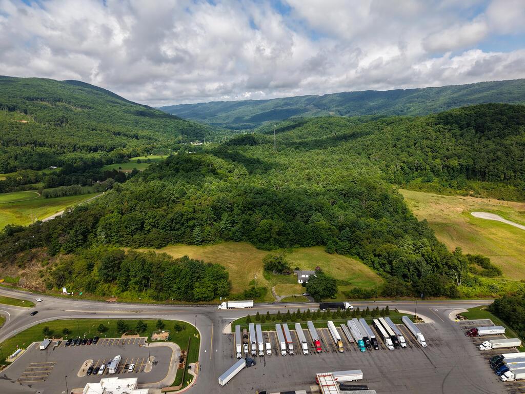 Prime Commercial Development Opportunity off I-77 in Bastian, VA! Positioned off Interstate 77 in scenic Bland County, this commercial parcel offers a e location for high-volume highway retail or premier national restaurant chains like Cracker Barrel seeking to capture steady interstate traffic. Currently offered as a prime 5-acre lot, the site boasts excellent frontage and topography ideal for immediate development. For buyers with larger commercial vision, additional adjoining acreage is readily available directly from the sellers to suit your specific site requirements. Strategically located along a crucial transportation corridor connecting North Carolina and West Virginia and beyond , this property provides exceptional exposure to thousands of daily commuters, long-distance travelers, and local patrons —making it a scalable commercial site in Southwest Virginia. Come check it out today!