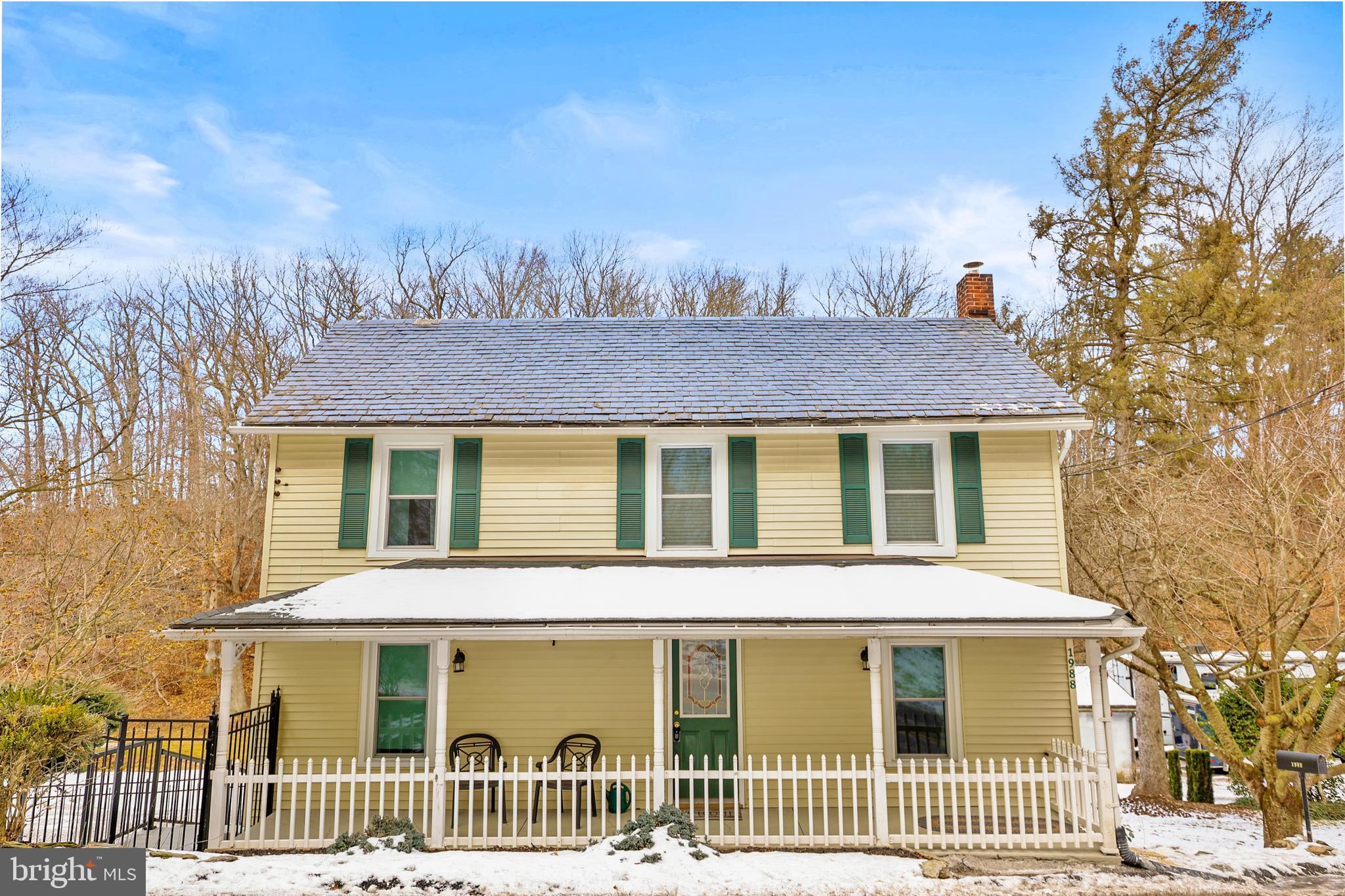 From the moment you arrive, this meticulously maintained property impresses with its inviting front porch and beautiful stained-glass front door. Step inside to a wide foyer where gorgeous old hardwood floors immediately set the tone for the quality, craftsmanship, and care found throughout the property.The formal dining room is spacious and elegant, featuring stunning old hardwood floors, French doors, and an eye-catching chandelier, making it ideal for gatherings and entertaining. The living room is bright and welcoming, surrounded by large replacement windows that frame peaceful outdoor views and fill the space with natural light.The table-space kitchen is both functional and attractive, offering custom cabinetry with pull-out drawers and exceptional built-in details throughout. Additional highlights include updated stainless-steel appliances, including a new Whirlpool 27-cubic-foot refrigerator with a built-in ice maker, a built-in microwave, a double sink, tile backsplash, solid surface countertops, a movable island cabinet, a chair-rail detail, gorgeous hardwood floors, and a striking pendant light over the sink. A full bath with a bathtub is also located on the main level. All window treatments convey.Upstairs, the bedroom layout has been thoughtfully reconfigured from three bedrooms into two generously sized rooms, along with a fully renovated full bath. The owner’s suite is filled with natural light from multiple replacement windows and features two closets, beautiful old hardwood floors, and elegant wall sconces. The second bedroom is also generously sized and offers matching hardwood flooring. The updated full bath includes a tile floor, a solid surface vanity, and a stall shower with carefully selected finishes. Fixed stairs provide access to the fully floored attic, offering exceptional storage space.The lower level includes a large open area, a full laundry room with additional storage, a half bath, and a utility room. A walk-out leads to the spacious covered deck, which is fully fenced and ideal for relaxing or entertaining.A very oversized detached garage with workshop space completes this impressive property.  One garage door is standard size, while the second measures approximately nine and one-half feet in height, making it ideal for larger vehicles or equipment.  The garage features propane heat, high ceilings, newer windows and doors, updated lighting, concrete floors, and a built-in workbench that stays.  A true car lover’s dream.Additional improvements include forced air heat with central air conditioning, replacement windows throughout, a newer hot water heater, and a newer oil tank. The property offers well water combined with public sewer, providing the best of both worlds. The front porch roof and rear addition roofs are newer asphalt, while the main slate roof has been meticulously maintained.The beautifully fenced yard features newer metal fencing and offers outstanding seasonal color, including a cherry tree, bleeding hearts, tulips, and forsythia bushes in the spring, with continued beauty throughout the year.Seller is offering a one-year home warranty for added peace of mind.  Located in the Southern School District and ideally situated for commuters traveling to York, Pennsylvania, or the Baltimore, Maryland area.  Absolutely move-in ready and meticulously cared for inside and out.Come out to the open house or schedule your private showing.