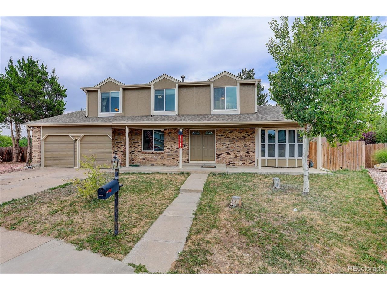 Terrific opportunity! Immaculate 2-story in Cherry Creek Schools. Tucked at the back of a quiet cul-de-sac, this home's double doors welcome you home right away. Just inside, you'll find a bright, flexible space that works equally well as a formal living room, a library, or a home office, whatever your life calls for right now.Keep going and you'll land in a generously sized family room, anchored by a statement brick fireplace fitted with a gas pellet insert, the kind of spot that just begs for a slow evening in. The kitchen sits just beyond, with newly refinished wood floors underfoot and a removable island that gives you the flexibility to open things up or add extra prep space, your call.Outside, a massive deck becomes your summer hangout with plenty of room. A formal dining room and large mud/laundry room round out the main floor.Upstairs, four bedrooms await, led by a primary suite with a bath remodel that could headline its own HGTV episode! The three secondary bedrooms are generously sized too, built back when bedrooms were actually meant to fit a bed and a life, not just a mattress. Downstairs, the finished walkout basement brings even more to love: a built-in bar, a second fireplace, a three-quarter bath, and a fifth non-conforming bedroom, all filled with natural light thanks to the walkout design.