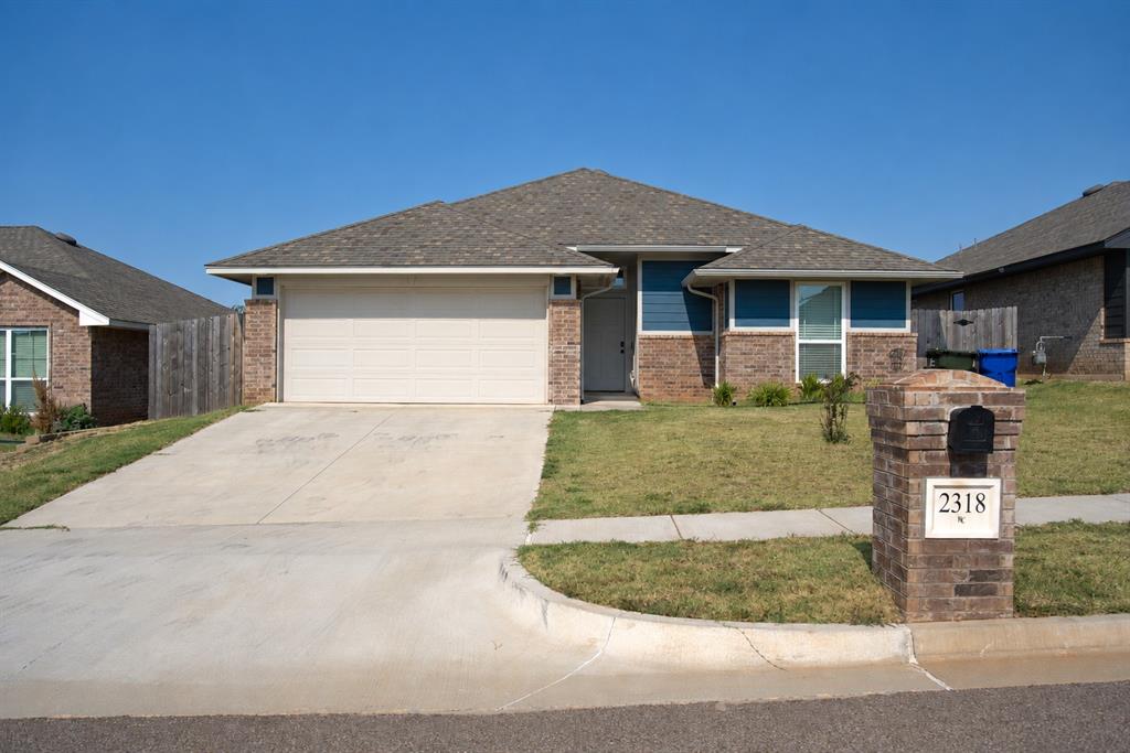Welcome to 2318 Arcady Ave in Norman! This well-maintained 3 bedroom, 2 bathroom home offers 1,540 square feet with an open, functional layout and thoughtful finishes throughout. The kitchen features white cabinetry, stainless steel appliances, ample counter space, a center island, and an open view into the main living area. Wood-look flooring extends through the primary living spaces, where a fireplace creates a comfortable focal point.The primary suite includes LVP flooring and a private bath with a soaking tub, separate tiled shower, dual-sink vanity, and walk-in closet. Two additional bedrooms provide flexibility for guests, an office, or additional living space.Outside, enjoy a low-maintenance fenced yard and access to neighborhood amenities including a pond, walking areas, playground, sport courts, and additional common spaces. Conveniently located with easy access to Norman shopping, dining, schools, and major roadways.