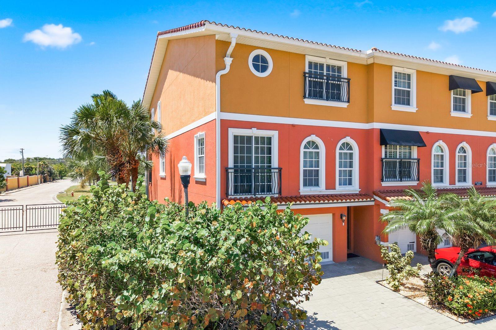 YOUR PIECE OF PARADISE AWAITS IN TARPON SPRINGS! RARE END UNIT OPPORTUNITY—enjoy maximum privacy, extra windows, and abundant natural light that middle units just can't offer! Boaters and luxury seekers, look no further than this 3-bedroom, 4-bathroom waterfront townhome boasting 2,500 sq ft of premium, low-maintenance living with DIRECT GULF ACCESS! Whether you are searching for a permanent coastal residence, a seasonal winter getaway, or a high-end CORPORATE RETREAT, this property delivers the ultimate lock-and-leave convenience because the HOA handles the exterior upkeep—giving you maximum time to enjoy your PRIVATE BOAT SLIP! The ground floor is a dream configuration, featuring an expansive 4-CAR GARAGE paired with a finished MANCAVE that includes a wet bar and direct access to a covered lanai ready for your outdoor kitchen setup. Skip the stairs and take your PRIVATE ELEVATOR to the main level, where a sun-drenched, open-concept floor plan connects a gorgeous culinary kitchen—complete with a walk-in pantry and a breakfast nook ideal for a HOME OFFICE—to a bright living space and a scenic sunset balcony. Escape to the third floor to find a lavish owner's suite outfitted with a dedicated sitting room, dry bar, private balcony, and a SPA-STYLE EN-SUITE featuring a deep soaking tub and standalone shower. A second spacious guest suite with its own private bath and a heavy-duty laundry room with built-in cabinetry round out the top floor. Situated just moments away from the historic Sponge Docks, vibrant local dining, shopping, hospitals, and airport access, this home merges peak convenience with coastal elegance. UNMATCHED WATERFRONT PROPERTIES LIKE THIS SELLING AT THIS PRICE POINT ARE A RARE FIND—CALL TO BOOK YOUR PRIVATE SHOWING TODAY!