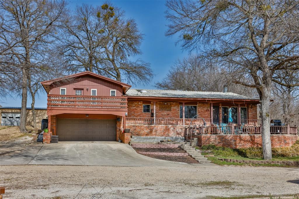 Beautifully renovated split level home blending timeless design with a striking mid century modern flair. Perfectly positioned beneath a canopy of mature trees, this property welcomes you with serene views of a winding creek and sweeping countryside the moment you step through the front door.Inside, a massive living area showcases soaring vaulted ceilings and a cozy wood pellet fireplace, creating a warm yet dramatic gathering space filled with natural light. The chef’s kitchen is designed to impress, featuring abundant cabinetry, granite countertops, upgraded appliances, and a generous island ideal for entertaining and everyday living. Each of the three spacious bedrooms offers its own private bathroom, providing comfort and privacy for family and guests alike. One suite even features a private walkout balcony overlooking the peaceful landscape — the perfect spot for morning coffee or sunset relaxation. Outdoor living shines just as brightly. Tiered patios create multiple spaces for hosting and unwinding, while the large in-ground pool with slide and custom cover promises endless summer fun. A 30x40 workshop with overhead door, electricity, and a full bath offers incredible flexibility for hobbies, projects, or business use. Solar panels add efficiency, and a dedicated garden area invites you to cultivate your own fresh harvest. This is more than a home…it’s a private retreat where thoughtful updates, character, and functionality come together beautifully.