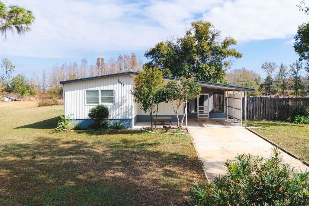 VERY MAINTAINED 1982 MANUFACTURED DOUBLEWIDE MOBILE HOME. ALL ON ONE ACRE. TAX RECORDS DO NOT REFLECT ADDITIONAL 13x10 SUN FLORIDA ROOM FOR A TOTAL OF 1090 SQ FT APPROX. ALSO HAS SPACIOUS 11x17 SCREENED IN PORCH, WKIN CLOSETS, NEUTRAL COLORS, HAS 8x11 UTILITY ROOM , AND WORKSHOP.SELLER WILL LEAVE WASHER AND DRYER. PROPERTY IS HIGH AND DRY AND BACKS UP TO CONSERVATION. HAS A BEAUTIFUL EVEN LANDSCAPE IN BACKYARD. MOST POSSIBLY ENOUGH SETBACK AND ROOM TO BUILD A BLOCK HOME BEHIND CURRENT RESIDENCE AND NOT DISTURB WELL & SEPTIC. PROPERTY BEING SOLD AS IS WITH RIGHT TO INSPECTION
