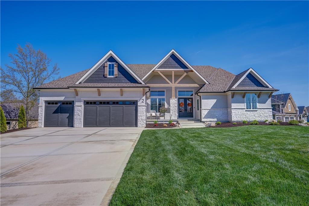 Custom-built by Pfeifer Homes, this stunning second-tier home at Lake Winnebago showcases the sought-after Trinity floor plan in a reverse story and a half design. Situated on a corner lot with a treed backyard, this home offers 3,533 square feet of beautifully finished living space, blending elegant finishes with warm, inviting design.The main level features 2,108 SF with an open concept living area highlighted by cathedral ceilings, beautiful hardwood flooring, striking beams, and light, neutral finishes throughout. The gourmet kitchen offers abundant cabinetry, a prep kitchen with a second oven and microwave, mini fridge, and seamless flow into the living room, perfect for everyday living and entertaining. Step outside to the patio just off the kitchen, complete with a cozy fireplace and built-in storage for cushions or outdoor essentials.The spacious primary suite is a true retreat, featuring a luxurious bathroom and an oversized walk-in closet. A second bedroom and full bath is also located on the main level. A spiral staircase leads to the walkout lower level, offering 1,425 SF of additional living space with a large recreation room, wet bar, game area, two additional bedrooms, two full bathrooms, a half-bath, and generous storage.Additional upgrades include 10-zone irrigation system, landscape upgrades, 2 garage openers, security system with cell dialer, and gorgeous window treatments.  As a 2nd tier Lake Winnebago property, this home has ongoing rights to a personal boat slip, just a short walk or golf car ride away.Enjoy all that the Lake Winnebago community has to offer, including a brand-new resort-style pool, horse stables, restaurant, parks, walking trails, tennis and basketball courts, and year-round community events. Come take a look and make this exceptional home your own!