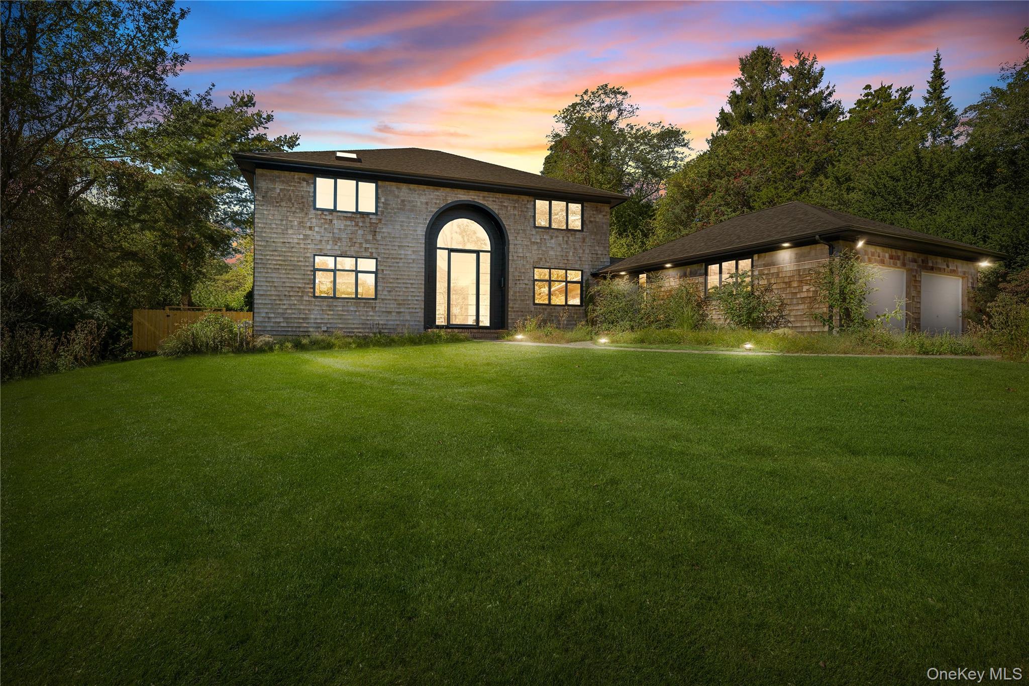 Rethought and masterfully redesigned by award-winning Italian architect Filippo Caprioglio, this contemporary Southampton residence embodies the seamless union of Italian architectural innovation and Hamptons sophistication. Every detail reflects a commitment to refined design, precision craftsmanship, and effortless luxury.

A dramatic double-height entryway welcomes you into light-filled interiors defined by minimalist lines and bespoke Italian finishes. Custom FASAL Serramenti Minimal72 windows and doors create a striking, steel-inspired profile while providing double-glazed thermal insulation for both comfort and efficiency.

Inside, new oak flooring flows throughout the home, complemented by a grand staircase handcrafted in Italy by Epicentro di Piva Guido. Serving as the architectural centerpiece, the staircase is custom-tailored with expansive glass steps and steel profiles, achieving a perfect balance of lightness and strength.

The home offers four en-suite bedrooms and four full marble baths, along with a powder room, each space carefully designed for privacy and comfort. Both the first and second floors feature primary suites, each with custom walk-in closets. The living room opens into a bright, welcoming space centered around a suspended fireplace, creating an atmosphere of modern warmth and elegance.

The chef’s kitchen is a showcase of contemporary design, featuring custom cabinetry in a white quartz lacquer finish, leathered white quartz countertops, and a Bertazzoni appliance suite. A Forno Arezzo 44" recessed ceiling hood adds a sleek, sculptural accent to the space.

Bathrooms are finished with marble flooring, custom vanities, and Kohler fixtures, blending timeless materials with modern simplicity.

Outdoors, a new heated gunite pool anchors the fully fenced backyard, surrounded by lush greenery for a sense of privacy and serenity. Ideally located steps from the beach and minutes to Southampton Village, this residence offers the perfect Hamptons lifestyle — a place to enjoy every season with style and sophistication.

Additional features include a two-car garage, a full basement, and a wireless security system.

If you are seeking the perfect Hamptons home, look no further than this magnificent modern masterpiece.