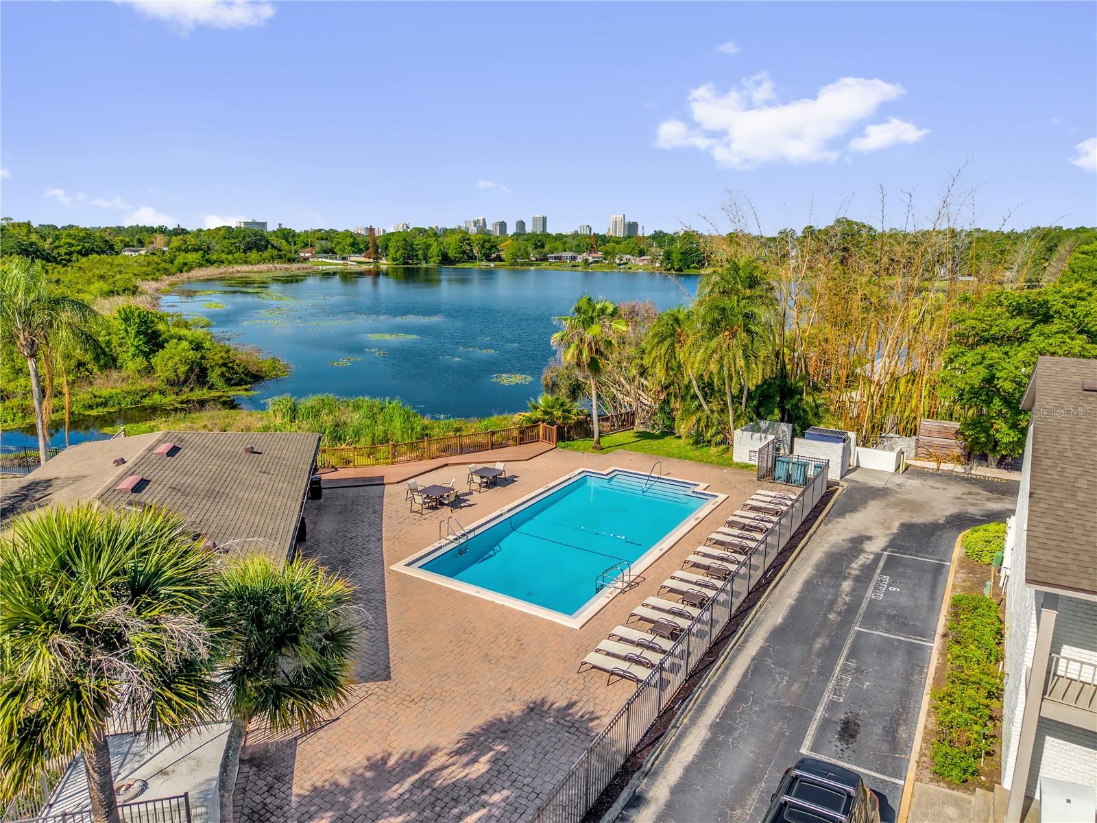 Located in the desirable Audubon Park, this upgraded 2-bedroom, 2-bath condo on the second-floor offers style, comfort, and convenience. Filled with natural light, the home features a functional open layout connecting the living area and kitchen, complete with a breakfast bar for easy entertaining. The split-bedroom floor plan provides privacy, with a spacious primary suite and a beautifully renovated en suite bath featuring a frameless glass shower, updated vanity, and added storage.Enjoy Florida living year-round on the screened-in porch with a private storage closet. Stainless steel appliances, plus a washer and dryer, all convey, along with a Nest doorbell and smart lock. A new HVAC unit with UV light and the sliding glass door to the balcony were both replaced in 2025.Just minutes from Downtown Orlando, Winter Park, and Baldwin Park, with easy access to Corrine Drive’s dining and shopping, and zoned for Audubon Park K-8 School. A great opportunity to own a well-appointed home in one of Orlando’s most sought-after neighborhoods.