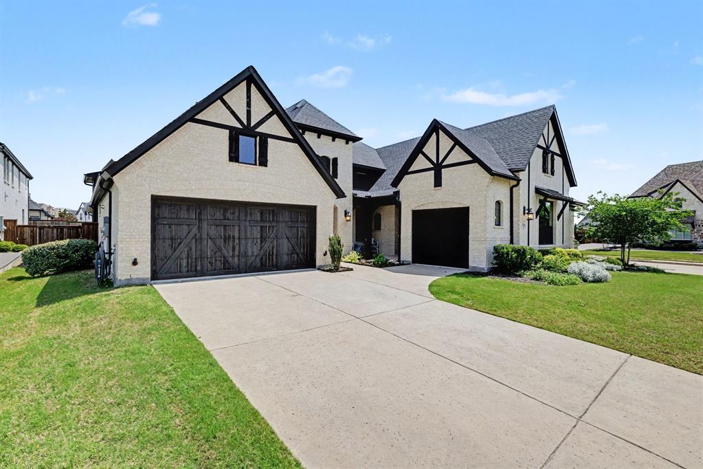 Stunning Modern Tudor by Conventry Homes on an oversized corner lot in highly sought-after Mustang Lakes Celina luxury homes. Built in 2021, this exceptional single-story home offers 6 Bedrooms, 3.5 baths, game room. Enjoy a spacious open-concept floorplan designed for everyday living. Rich hardwood floors, decorative lighting, custom built-ins, and a gas fireplace highlight the inviting living room. Chef’s kitchen features quartz countertops, oversized island, farm sink, gas cooktop, convection oven, coffee bar area, and large walk-in pantry. Spacious primary suite offers dual vanities, soaking tub, oversized shower with body sprays, and walk-in closet. Private secondary suite with lounge area and full bath provides ideal flexibility for guests, extended family, or multigenerational living. Covered patio overlooks a large backyard and close proximity to a stocked pond. Oversized 3-car garage. Located in Prosper ISD.  The Club at Mustang Lakes resort-style community has so much to offer, including front yard maintenance included in HOA fee, 5-acre stocked lake with island, fishing deck and bridges, Clubhouse, Junior Olympic pool, resort pool and tot pool with waterfalls, tanning decks, competition tennis courts, basketball courts, amphitheater, 18 miles of scenic trails, and playground. **This property qualifies for a lender paid 2-1 buy down for qualified buyers, ask agent for details!**