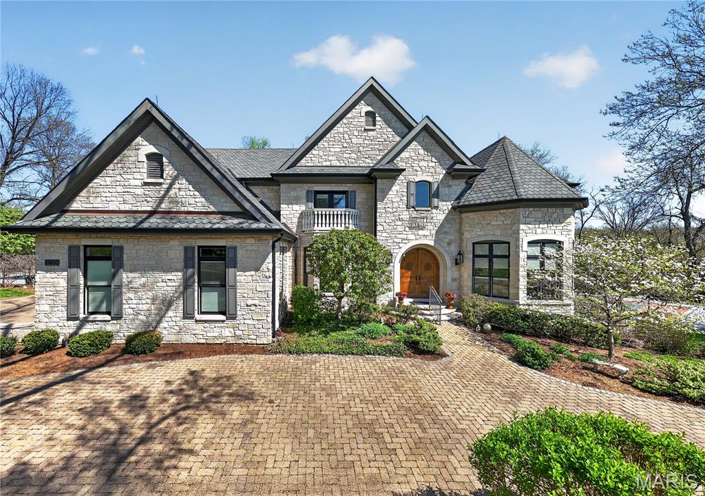 This beautiful estate with truly check all your boxes with quality construction, endless amenities, and centrally located in the Ladue school district within walking distance to Spoede elementary. Wonderful curb appeal; situated at the end of a culdesac and next to community park, constructed with predominately stone with stucco accents, this beautiful home will certainly stand out from the competiton. A gorgeous private, gunite, salt water pool is located off of the kitchen and charming screened porch.  It is boardered with inlain stones creating plenty of area for play and entertaining.  There is also a private patio to the rear that creates that private setting for quite dinners and barbque time. Lastly, there is a private sport court for pickelball and basketball which is fenced and can be enjoyed day or night with lighting.  Inside the rooms are expansive with soaring ceilings, wood floors, and rich moldings. A spacious 2 story entry with custom staircase leads to the private dinning room with wood flooring, tray ceiling and formal study with built in bookcases and rich woodwork on walls and ceiling. The greatroom is located in the center of the home with a wall of windows to the rear overlooking the private patio: two stories, gas fireplace, wet bar, wood floors, balcony overlooking from upstairs bedroom area. The kitchen/hearth room is truly like no other with a large center island that opens to sitting and breakfast room area;  Wood floors, gas fireplace, stone accent wall, freshly painted, custom cabinets, hard surface counters, stainless appliances, vaulted ceiling, walk in pantry, planing desk, butlers pantry, half bath, huge laundry with endless builtins.  The primary bedroom that is very generous in size is also located on the main floor and has new carpeting, wood floors, walk out to private deck overlooking rear patio and sport court, gas fireplace, two large customized walk in closets and a private in suite bath with double vanities, separte tub and shower, private camode area.  Upstairs there are three large bedrooms all with their own private bath and walk in closets.  These three rooms have been recently painted with new carpet as well.  The lower level is perfect for entertaining with a large walk behind wet bar, family room with gas fireplace that walks out to rear lower level patio and sport court, recreation room, wine celler holding over 1000 bottles, exercise room and 1.5 baths. There is a 9 foot pour in the lower level with a stamped concrete floor. Roof was recently replaced.  3 car side entry garage with front circle drive. In ground sprinklers, security system and Geothermal heating and cooling. This home has it all and truly is the one you will never want to leave.