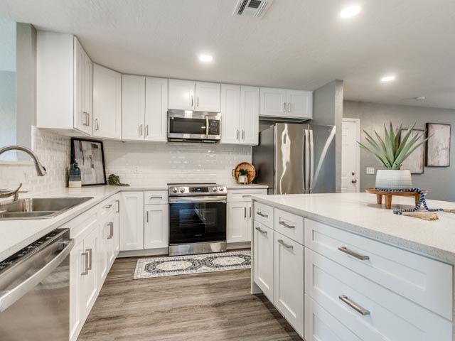 Check out this beautifully updated, 4-bedroom with office (can be a 5th bedroom) property, featuring 2.5 baths and a 2-car garage sitting on a quarter of an acre lot!  Step inside to discover a beautifully renovated interior showcasing modern, neutral tones throughout. Recent upgrades include fresh interior paint, new kitchen and bathroom cabinetry, a stunning waterfall quartz island, updated vanities, new kitchen appliances, a stylish backsplash, and granite or quartz countertops. The home features all-new flooring, including durable vinyl plank in the main living areas and carpet in the bedrooms. You’ll also find ample storage space with multiple additional closets throughout. Don’t miss the oversized, fully fenced backyard, complete with a spacious patio featuring brand-new Trex decking—perfect for outdoor entertaining. The property also includes a tornado shelter conveniently installed inside the garage. Location is another major advantage. The home is just minutes from the Veterans Memorial Park and offers convenient access to I-35, providing easy connectivity to destinations throughout the metro.