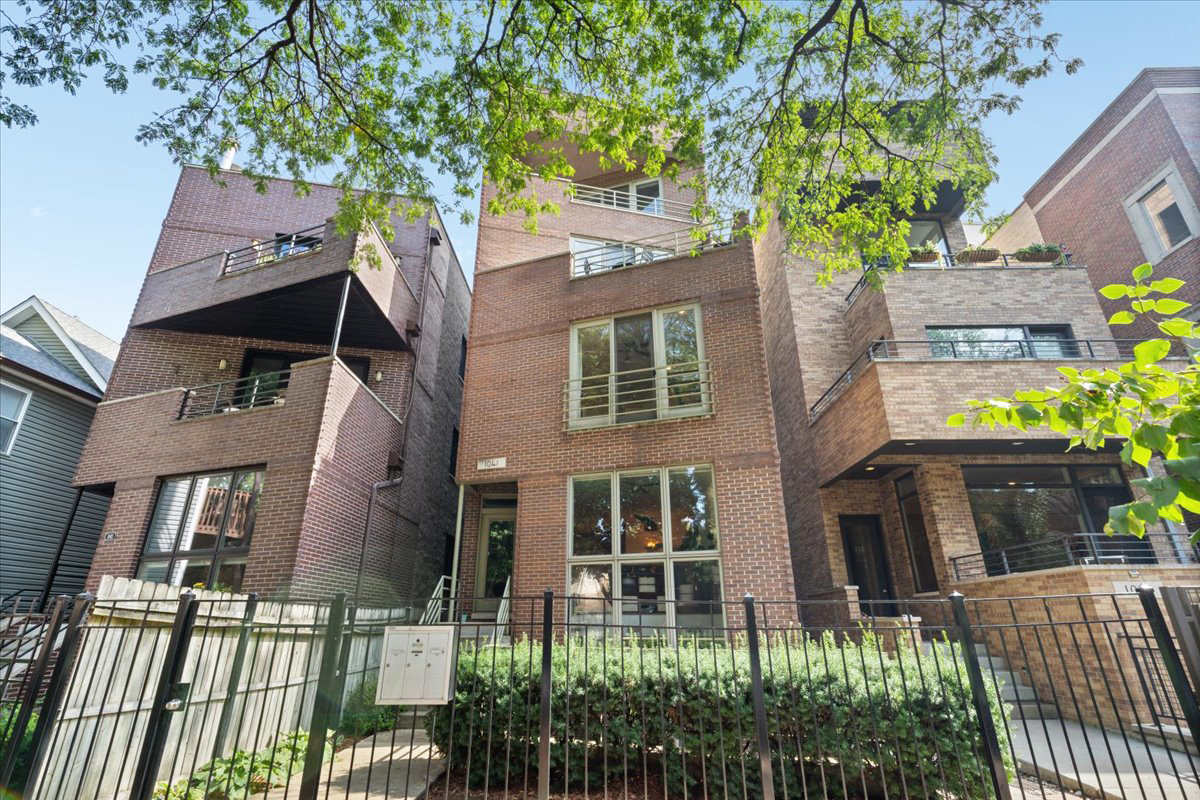 Incredibly updated 2bed/2bath with a spacious PRIVATE deck on a quiet, tree-lined street - steps from all of the vibrant WEST TOWN attractions on Division St and WICKER PARK! This sun-drenched home features high ceilings, floor to ceiling windows, hardwood floors, desired open concept kitchen/living spacious enough for a dining table, cozy fireplace, seamless indoor/outdoor living flow that would be perfect to entertain and IN-UNIT Washer/Dryer. The upgraded spacious kitchen boasts white cabinetry, granite countertops, stainless steel appliances and a convenient eat-in breakfast bar. ENORMOUS primary suite showcases high ceilings, abundant natural light from the Juliet balcony overlooking the charming tree lined street, an organized WALK-IN CLOSET plus a luxurious primary ensuite with HEATED floors, dual vanity, granite countertops, oversized walk-in shower w/ waterfall head and beautiful finishes. An additional spacious bedroom and bathroom down the hall complete the layout. One garage spot included in the price plus additional storage in the basement. AMAZING LOCATION!! Just minutes away from public transportation, the highway, Mariano's and walking distance to all the great restaurants like Kasama, coffee shops, boutiques and nightlife, as well as everything Wicker Park, East Village and Ukrainian Village have to offer!!!