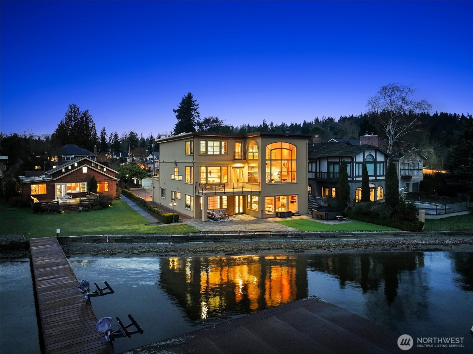 Spectacular Lake Washington waterfront opportunity featuring two adjoining properties set on beautiful, level parcels w/100 feet of prime combined frontage in highly sought-after Sheridan Beach. The 2 respective residences enjoy expansive southeast-facing views across Lake WA to the Cascade Mountains, Inglewood Golf Club and Arrowhead Point, along w/sweeping vistas toward the north end of the lake, Mt Rainier, Magnuson Park & endless sunrises. The larger 4,930 SF, 4 BD, 4.5 BA Mediterranean-style home features floor-to ceiling windows, luxurious chef’s kitchen, 2 spacious primary suites & lower level with 2nd kitchen, family room & 2 add'l BDs. Deck & patio, relaxing waterside hot tub & level turf lawn extending to the no-bank shoreline. The exceptional outdoor setting also includes the property’s right to access the 110' shared dock on the adjacent property via recorded easement. To the SW, the smaller 1,590 SF, 2 BD, 2 BA home, originally built in 1929, has been thoughtfully updated over the years & features a recently renovated kitchen & BAs. Light-filled living spaces opens to a spacious entertaining deck & level lawn. 110' shared dock w/boathouse w/boat lift & 2 jet-ski lifts. The properties are perfectly located on a quiet residential lane, within walking distance to Lake Forest Park Town Center & the Burke-Gilman Trail & just 10–15 mins to U-Village, Magnuson Park & the rest of Seattle. An exceptional opportunity to own a stunning Lake Washington waterfront estate!