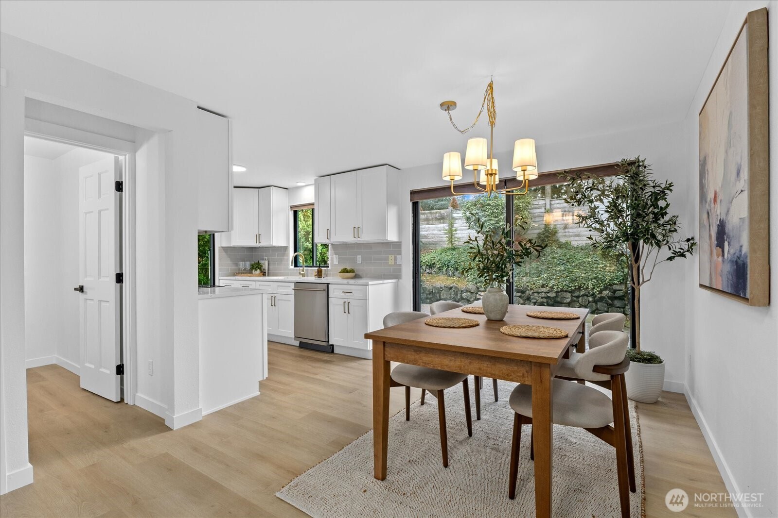 Lakefront Living! Welcome to this fully updated end-unit townhouse in a gated community on beautiful Spanaway Lake. Enjoy direct lake access, a cozy fireplace, & an expansive kitchen & dining area perfect for entertaining. This home features sleek quartz countertops, high-end appliances, & luxury flooring throughout. Upstairs, floor-to-ceiling windows fill the home w/ natural light & showcase water views, private backyard deck. Amenities include a dock, boat launch, clubhouse, RV/boat storage, tennis court, & swimming pool. Two parking spaces & every modern convenience, this rare end-unit seamlessly blends style, comfort, & lifestyle. Don’t miss the opportunity to experience lakefront living at its best. Welcome home!