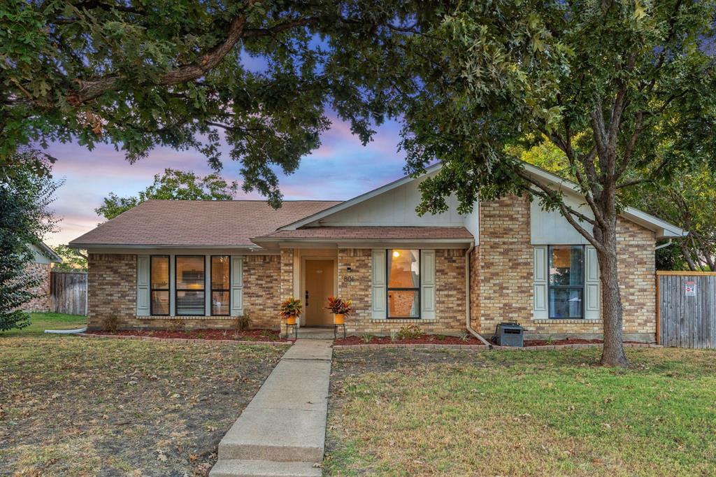 Beautifully updated home on a spacious corner lot directly across from Clearview Park! Step out of your front door to the playground, ball-fields and the scenic Lookout Trail right across the street. Inside, you’ll find an open, flowing floor plan designed for comfort, connection and everyday ease. Inviting living room with vaulted ceilings, a striking floor-to-ceiling brick fireplace, and seamless access to the covered patio and expansive backyard, perfect for movie nights, backyard barbecues or simply relaxing in style. The large windows wash the space in natural light and frame views of the lush corner lot. The kitchen is bright and cheerful, featuring updated counters and cabinets, a smooth-surface electric range, new custom blinds, and a brand-new dishwasher. Refrigerator is included, making this home truly move-in ready. Quaint dining area just off the kitchen with large sunny window. Retreat to the private primary suite, where you’ll notice new luxury vinyl plank flooring, and an updated en-suite bath with dual sinks, tub and shower, abundant storage, and generous walk-in closets. The two secondary bedrooms are well-sized, each sharing an updated full bath now finished with modern bidet toilets — a thoughtful luxe touch! There’s an added dog run, giving pets their own space to roam safely. The generous backyard area ensures room for fun, games or lounging on warm afternoons. Covered patio access and expansive corner-lot. Prime location: Just minutes from Hwy 75, Clark Stadium, High Point Park and Enfield Park, and only a short drive to the vibrant shopping and dining scenes in downtown Plano, Richardson and Allen. Move-in ready, tastefully updated, and perfectly situated — this home offers comfort, character and convenience in one exceptional package.