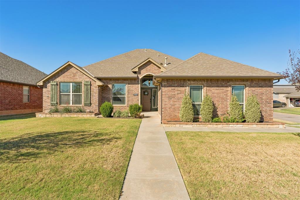 The perfect combination of space, style, and location—right in the heart of Deer Creek! Beautifully maintained and ideally situated on a corner lot, this lovely 3-bedroom, 2-bath home is filled with warmth, natural light, and inviting spaces. At the heart of the home is an oversized eat-in kitchen with abundant counter space perfect for hosting, meal prep, or pulling up a chair for easy conversation with the living room. A beautiful stone fireplace with wood-burning logs anchors the living space, while large windows throughout the living and dining areas fill the home with natural light. The spacious primary suite offers plenty of room to unwind, overlooking the backyard for added privacy and beautiful views. The ensuite bath features double sinks with upgraded countertops, a glass-surround walk-in shower, stylish soaking tub, and generous storage. Two oversized secondary bedrooms share a spacious hall bath, offering plenty of room for family or guests. Outside, the large backyard is beautifully maintained with room to play, garden, or simply enjoy the outdoors. A generous patio provides the perfect spot for grilling, entertaining, or relaxing at the end of the day. All of this in sought-after Deer Creek Schools with quick access to the Kilpatrick Turnpike, making it easy to get anywhere in the metro!