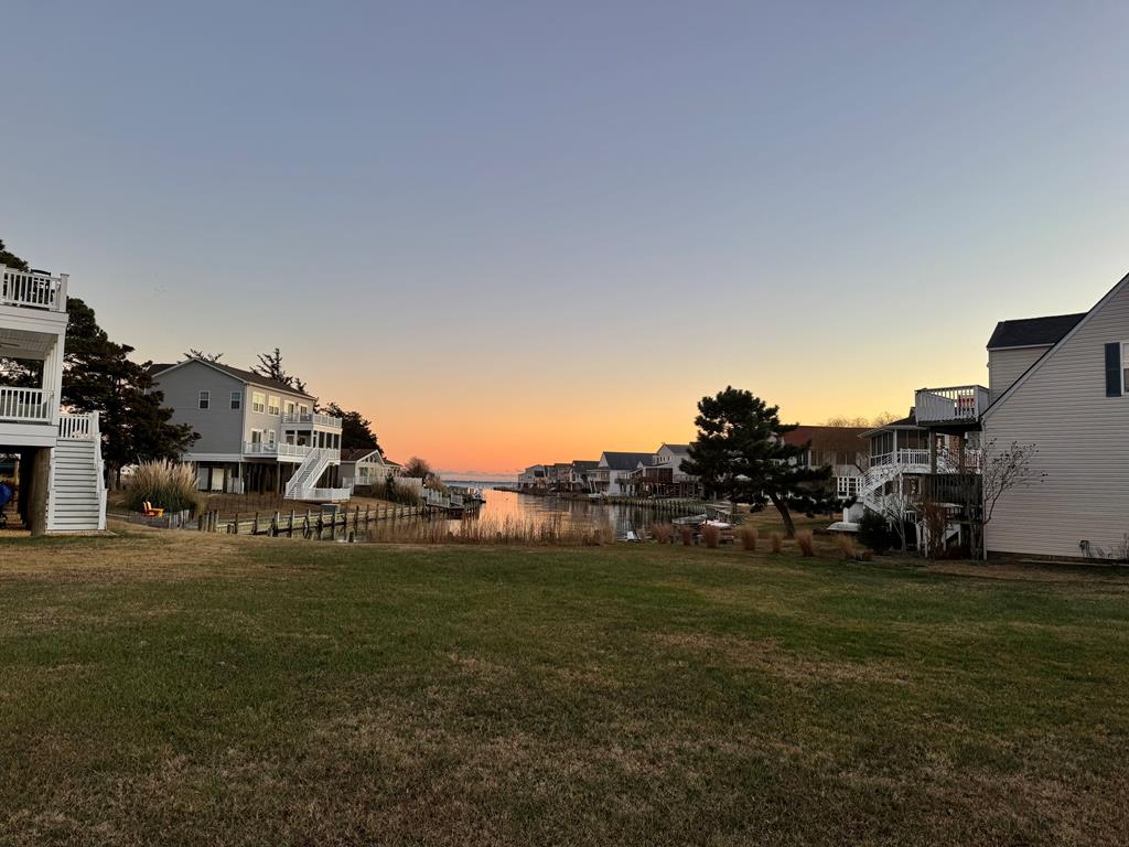 This waterfront lot is ready for you! Come and visit the resort community of Captain's Cove and you will see why this is the perfect lot to build your dream home on. This canal front lot is situated at the end of a canal in section 3 with public utilities available. There is no builder tie in. Buy now and build at your convenience while enjoying the luxuries of Captain's Cove such as indoor and outdoor pools, restaurant, banquette rooms, fitness center, basketball & tennis courts, boat launch, playground, security & so much more! All included in the HOA fees. Just minutes to the beach!