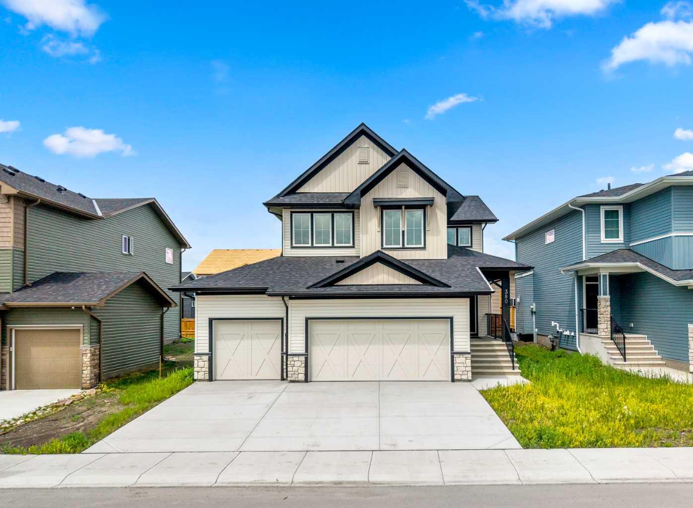 OPEN HOUSE Wednesday July 29th Noon - 2pm. 380 Northern Lights Green! Wouldn't you love to have an address like this?  Situated in the community of Painted Sky, walking distance from the newest shopping centre in Langdon this 3 Bedroom home completed in late 2025 is an absolute Gem! Why wait months for a new build, when this upgraded 2 Storey house with a Triple Garage is Move-In Ready!  The most popular room in the house... the Kitchen is a Dream. Step up to the gorgeous stone waterfall island and create your culinary masterpiece.  Complete with a Gas Range, full ceiling-height cabinetry, and a butler's pantry, this kitchen awaits your next gathering of friends and family. The Living room is the perfect place for conversation while enjoying the warmth of the feature fireplace.  Just around the corner, you'll find a versatile main floor den - perfect for your home office, or perhaps even a bedroom if need be.  Upstairs everyone in your home will find their perfect retreat to relax, starting with in the family room - Movie Night anyone?  The Primary Suite includes a 5 piece En-Suite Bathroom with dual sinks, a separate shower, and soaker tub.  Need space to put together your look? The massive Walk-in closet has plenty of space for all of your fashion treasures.  The laundry? So easy - it's right outside the walk-in closet.  The 2nd and 3rd bedrooms share another 5 piece bathroom with dual sinks - so smart for family living.  Need room to park your toys? The triple garage will house them easily, along with room for additional parking on the driveway.  Book your viewing of this move-in ready home today.