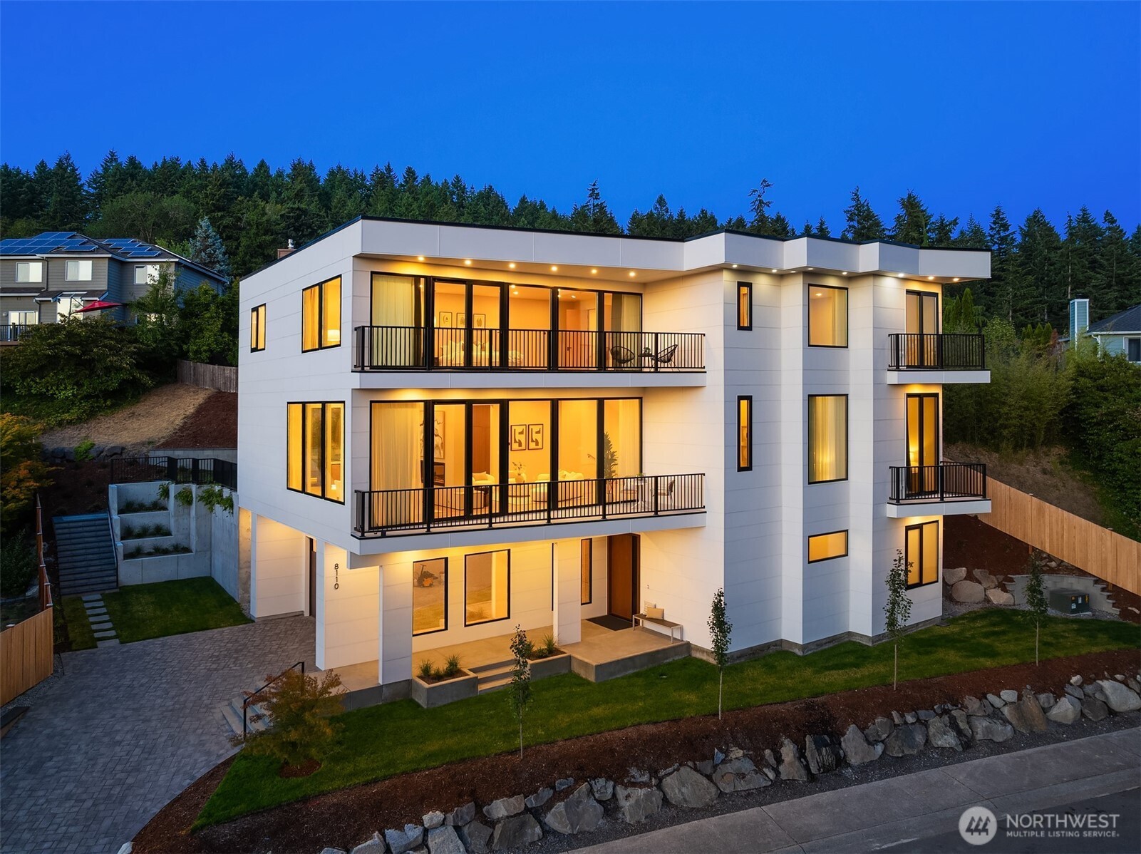 Elevated design and thoughtful innovation come together in this custom-built new construction home, where everything has been thought of! Set on a quiet dead-end street with Mt. Rainier and city views, this home is anything but typical. From 12-foot ceilings, triple-pane tilt-and-turn windows, hidden hinges, and remote-controlled privacy glass, the details here are both intentional and functional.     At the heart of the home, the kitchen pairs Thermador and Wolf appliances with Cambria quartz surfaces, an oversized walk-in pantry, specialty produce drawers, and sleek push-to-open cabinetry, and all those little conveniences you didn’t know you needed until you have them. Every bedroom offers an en-suite bath with custom built-in closets.  The wellness retreat features a sauna, shower, wet bar, and cold-plunge hookup, creating a space dedicated entirely to restoration.     A 14 kW solar system, solar-connected EV fast charger, power shades, in-ceiling speakers, whole-home water filtration, and extensive sound insulation bring modern performance seamlessly into everyday living. Multiple balconies extend the living space outdoors. All just minutes from Downtown Bellevue, I-90, 405, Newcastle Commons, Lake Washington, and endless outdoor recreation.