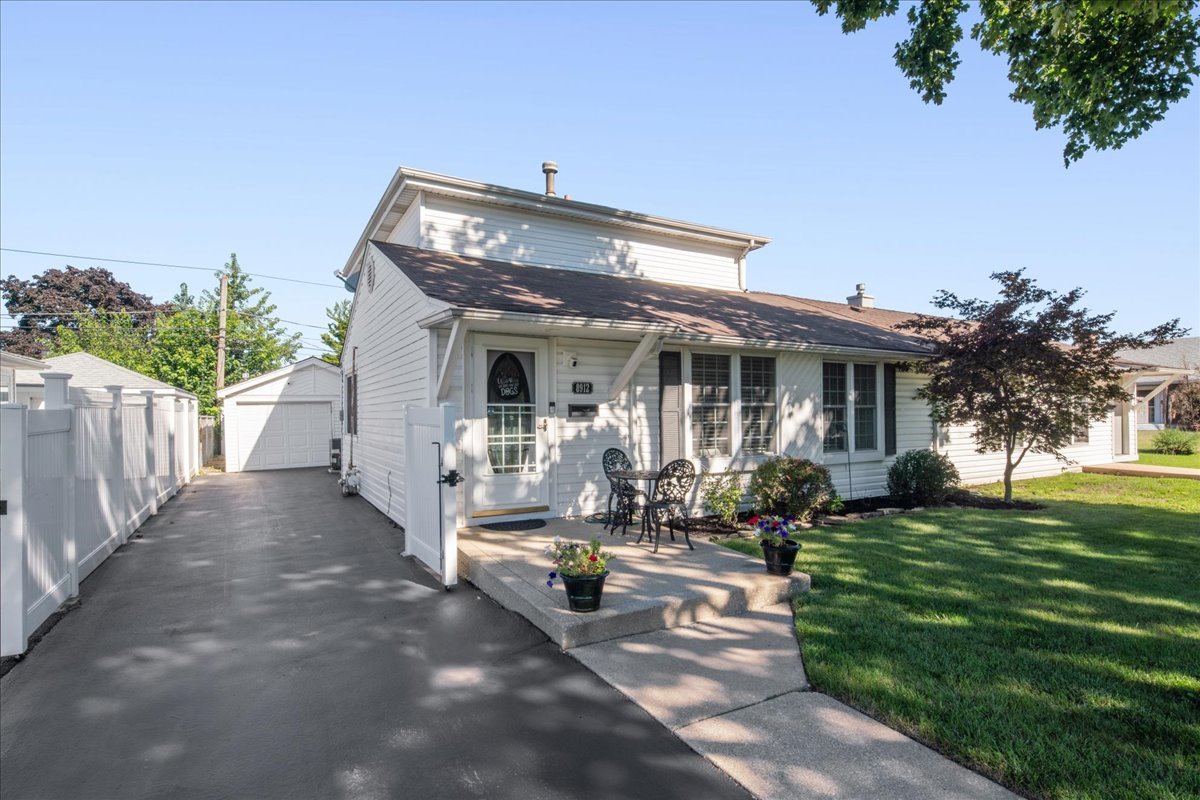 For the first time in over 30 years, this well-maintained gem is available in Hometown! This beautifully updated duplex offers the perfect blend of comfort, style, and convenience. Featuring 4 spacious bedrooms across two levels, including a primary suite on the top floor with its own bath, this  generous and open layout includes two family living spaces, an upgraded kitchen and the convenience of in-unit laundry-plenty of room for both relaxation and entertaining.  Modern updates and gleaming hardwood floors flow throughout the open floor plan, filling the home with warmth and natural light. Outdoors, enjoy a private deck, paver patio, and a beautifully fenced-in yard for added privacy-perfect for coffee mornings, summer evenings, or weekend gatherings. A 1-car garage, side driveway, and ample parking add extra value, a rare find at this price point.  Ideally located near schools, parks, shopping, and transportation, this move-in ready, low-maintenance home truly has it all.