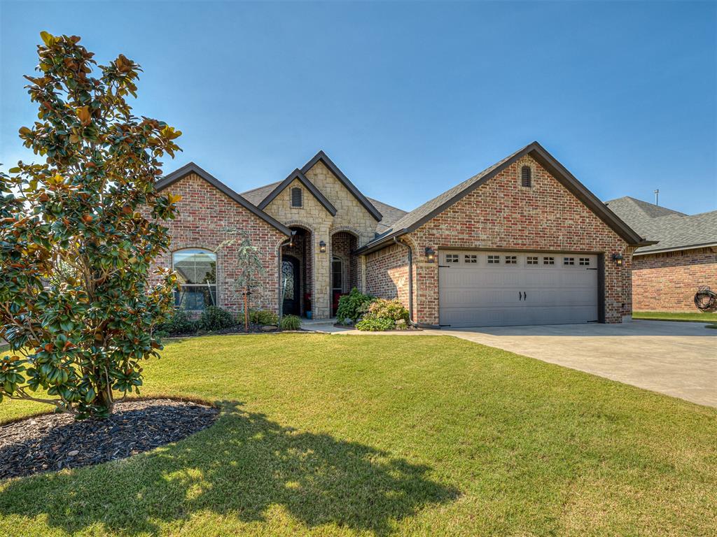 Welcome to this beautiful home in the sought-after Talavera community. Featuring 3 bedrooms plus a dedicated office, this property is thoughtfully designed with an open floor plan, vaulted ceilings in the living room, and a striking floor-to-ceiling stone fireplace as the centerpiece. Upgrades include a whole-home central vacuum system, tankless hot water heater, in-ground storm shelter, and impact-rated shingles. The extended garage offers a third garage door lift to the backyard and a garage utility sink for added convenience. The refrigerator remains with the home, and the landscaping is a true highlight—featuring a magnolia tree, hydrangeas, and strawberries.  The outside has a lovely covered patio and concrete sidewalk surrounds the exterior for easy access. Conveniently located near Moore schools with quick highway access, plus shopping and dining close by, this home offers both comfort and community in one perfect package.