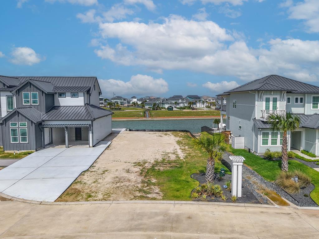 Positioned on "The Point" at the end of Foxtail Lane in the prestigious Reserve at St. Charles Bay, this exceptional waterfront homesite offers one of the most desirable locations in the community. With a drainage easement bordering the property, you'll enjoy added privacy and extra separation from neighboring homes. The long, deep lot provides ample space for a spacious custom residence, driveway, outdoor living areas, and pool, while pristine canal frontage offers direct access to some of the finest fishing and boating on the Texas Coast. The east-facing rear exposure captures breathtaking sunrise views over the water and welcomes refreshing coastal breezes year-round, while naturally shielding your outdoor spaces from the afternoon summer sun. Included with the sale are thoughtfully designed home plans for an approximately 2,800-square-foot coastal retreat featuring 3 bedrooms, a bunk room, and open-concept living spaces, allowing you to fast-track your dream home. Nestled within a private and serene setting, residents enjoy access to The Reserve's premier amenities, including a resort-style pool overlooking preserved wetlands, a fishing pier, and over two miles of scenic boardwalks winding through the coastal landscape. With limited inventory remaining, opportunities to secure a homesite of this caliber are becoming increasingly rare. Whether you're seeking a primary residence, vacation retreat, or legacy waterfront property, this must-see lot offers the perfect opportunity to create your own slice of coastal paradise.