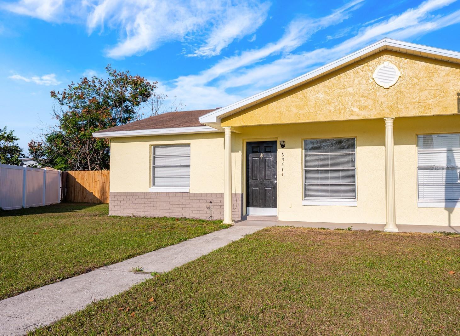 One or more photo(s) has been virtually staged. Ask about a lender provided RATE BUY-DOWN CREDIT on this home! ***MORE THAN 20K IN IMPROVEMENTS WERE COMPLETED IN 2025 - ALL NEW FLOORING, BRAND NEW APPLIANCES, NEW WATER HEATER, NEW FENCING, FRESH EXTERIOR PAINT and more – a huge value for first-time buyers and investors alike. ***MOVE IN READY and packed with UPDATES, this single-story 3-bedroom, 2-bath, 1/2 duplex in Orlando’s Meadow Cove community delivers easy living, a private backyard, and NO HOA!  Inside you will find versatile living spaces with nice natural light and an UPDATED KITCHEN that ties the home together. The PRIMARY SUITE sits quietly at the back of the home, paired with two additional bedrooms and a second full bath for a flexible layout that works for guests, family, or a home office. Enjoy the outdoors with both a covered front porch and a back patio, plus a huge FULLY FENCED backyard offering room to relax, garden, or entertain. The oversized backyard is a rare find in this price point! All of this comes in a convenient Orlando location with easy access to many major roadways like SR 551, 436, 528, 417, as well as neighboring Conway, Belle Isle, Downtown Orlando, shopping, dining, parks, and more. You are also just minutes from the Orlando International Airport, making this an ideal home base or a smart long-term investment. Updated, low-maintenance, well located, and truly move-in ready – this Meadow Cove home checks all the boxes. Call today to schedule a tour!