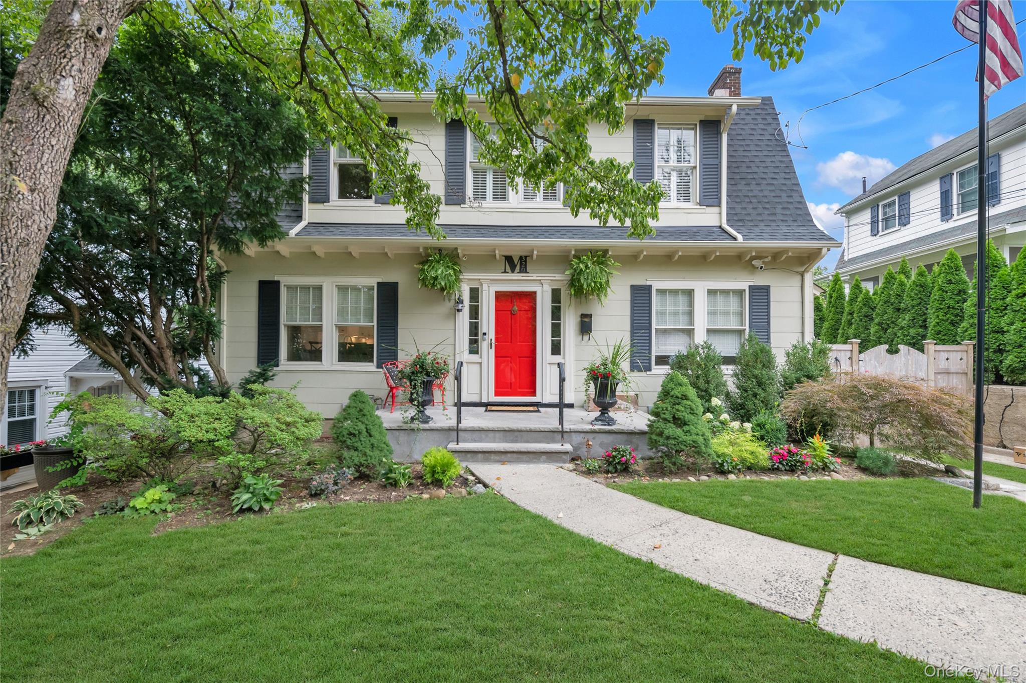 Welcome to 320 Forest Road, a beautifully renovated 1920 Dutch Colonial in the coveted historic waterfront community of Douglaston Manor.The home blends timeless character with modern updates, including a renovated kitchen 2021, updated bathrooms, hardwood floors, central air, gas heat, new windows, updated lighting, new gutters, and a new roof installed in 2025. Additional features include a designated laundry area, finished basement, excellent storage, and a classic wood-burning fireplace.Sun-filled living spaces open to a landscaped, south-facing backyard with an updated covered deck—ideal for entertaining or relaxing outdoors.Located among tree-lined streets and distinctive architecture, Douglaston Manor offers neighborhood charm with convenient city living. Optional Douglaston Club membership provides access to recreational and social amenities, while the Douglaston Manor Association’s $900 annual dues support common grounds, dock maintenance, and private security.A rare opportunity to enjoy the character of historic Douglaston Manor with the comfort and convenience of modern living.