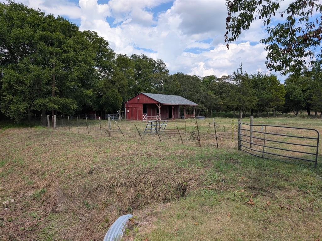 Seize this rare opportunity to purchase a property that has not been available for over 30 years! Tucked away at the end of a cul-de-sac street in the heart of Fairview, this nearly six-acre estate property offers the tranquility of a slower-paced life, privacy, strong investment potential, and numerous opportunities for recreation and income generation. It is uncommon to find a retreat from city life while still enjoying the proximity and convenience of nearby shopping and transportation.

Without the restrictions of a homeowner's association and with fewer building regulations, the owner has tremendous flexibility in land use. Options include constructing a custom estate home, renting out the existing home, keeping horses and or livestock, while maintaining the current Agriculture Tax Exemption deduction (note: reapplication is necessary as it does not convey automatically). This residential lot is surrounded by many estate properties and communities, enhancing its appeal.

As land in this high-growth area becomes scarcer, the potential for this property to appreciate makes it a sound long-term investment.

### Location and Features:
- Close proximity to city conveniences such as restaurants and shopping.
- Located within the highly-rated Lovejoy Independent School District.
- The land's natural beauty is highlighted by rolling hills and wooded areas.
- A creek on the property provides an ideal site for a bridge to access a secluded estate building site (a culvert is already in place).

Don't miss this unique chance to secure a piece of serene, yet conveniently located property that promises both lifestyle benefits and potential investment rewards.

This property is occupied and the majority of the land lies to the East of the home.